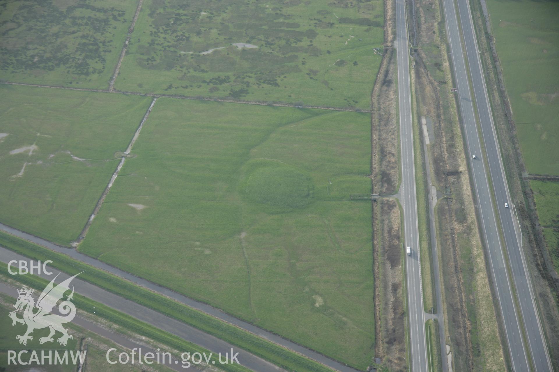 RCAHMW digital colour oblique photograph of Mynwent-y-Llwyn mound. Taken on 20/03/2005 by T.G. Driver.