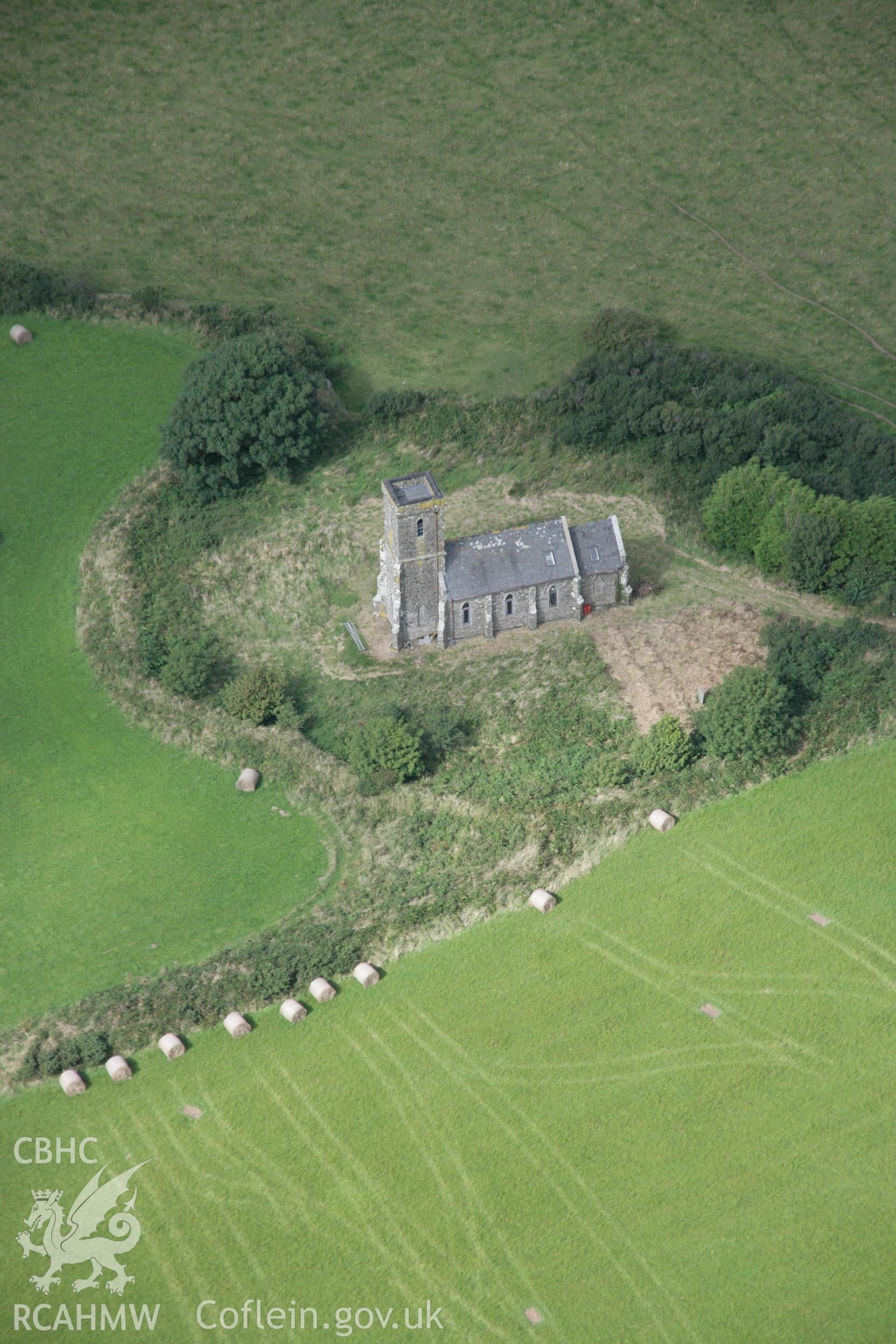 RCAHMW digital colour oblique photograph of St. Edren's Church and its circular churchyard viewed from the south-west. Taken on 01/09/2005 by T.G. Driver.