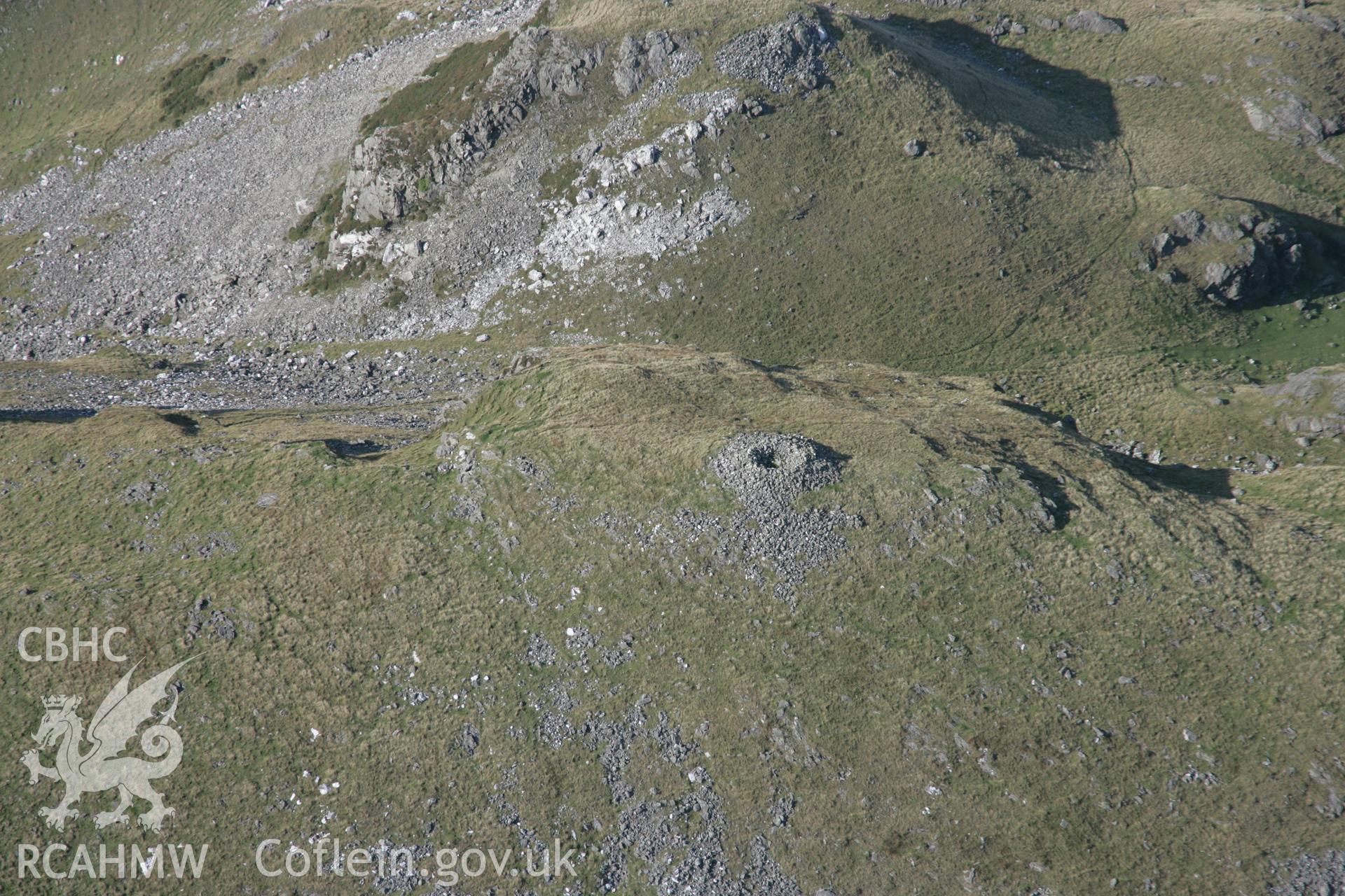 RCAHMW colour oblique aerial photograph of Craig Yr Aderyn Cairn and possible defended enclosure, looking north-west. Taken on 17 October 2005 by Toby Driver