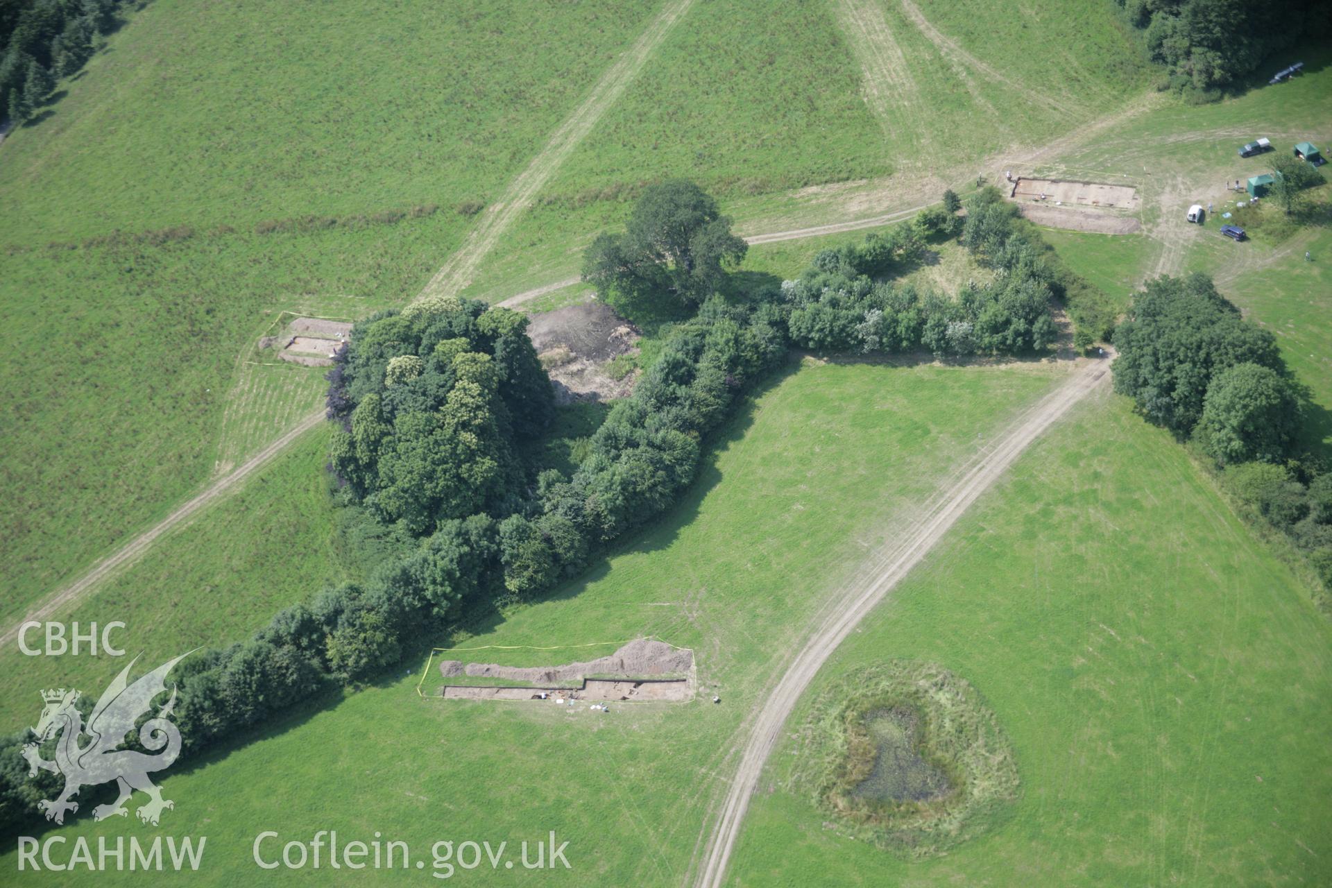 RCAHMW colour oblique aerial photograph of Dinefwr Park Roman Forts. The main excavation trenches viewed from the east. Taken on 11 July 2005 by Toby Driver