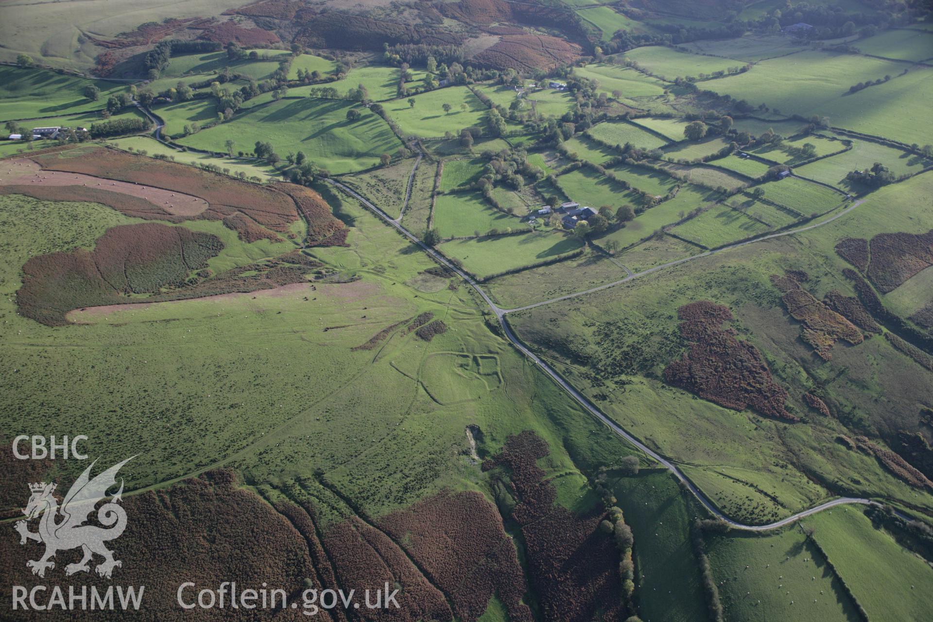 RCAHMW colour oblique aerial photograph of Moelfre Hill Deserted Rural Settlement, in wide view looking south. Taken on 13 October 2005 by Toby Driver