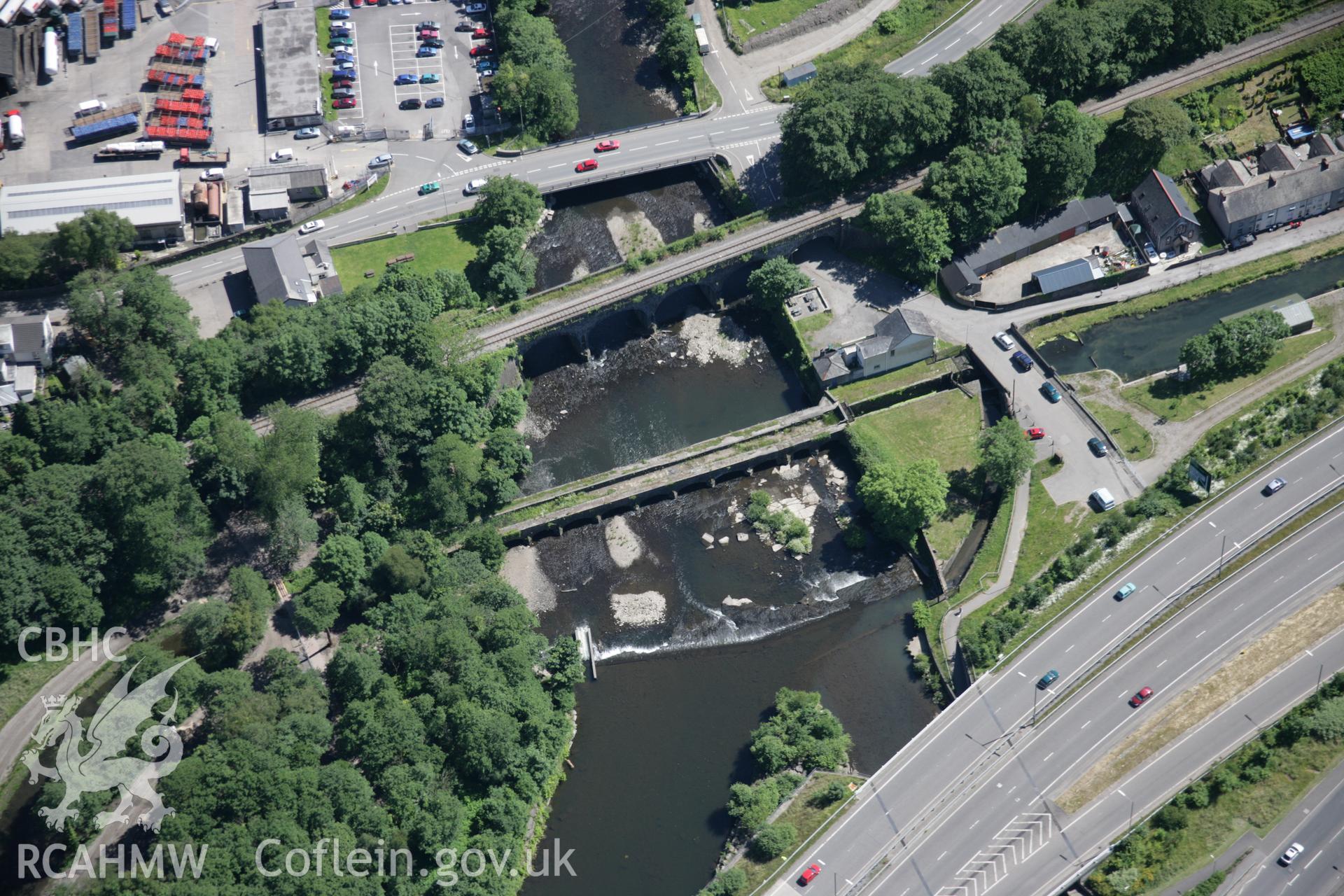 RCAHMW colour oblique aerial photograph of Aberdulais Aqueduct, and Vale of Neath Railway Bridge, viewed from the north-west. Taken on 22 June 2005 by Toby Driver