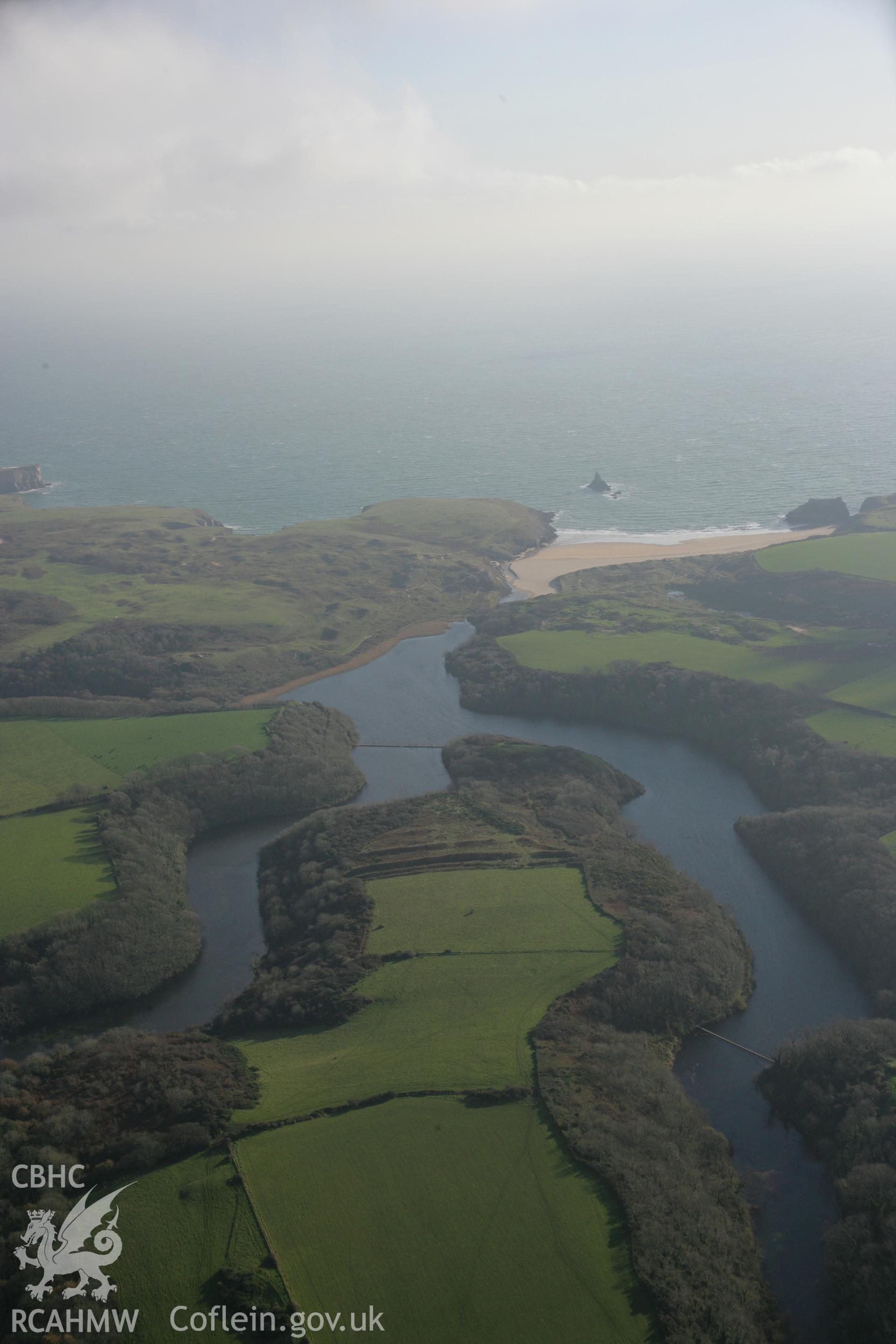 RCAHMW colour oblique aerial photograph of Bosherston Camp. A panoramic view from north-west, with Stackpole Warren beyond. Taken on 19 November 2005 by Toby Driver