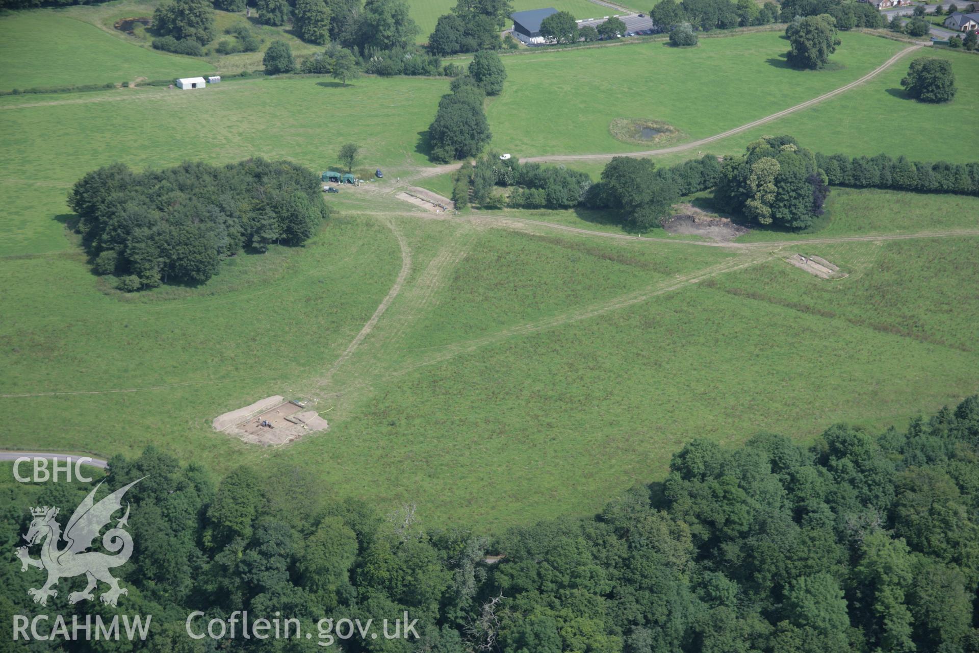 RCAHMW colour oblique aerial photograph of Dinefwr Park Roman Forts. A view of the parkland from the south-west showing excavation trenches. Taken on 11 July 2005 by Toby Driver