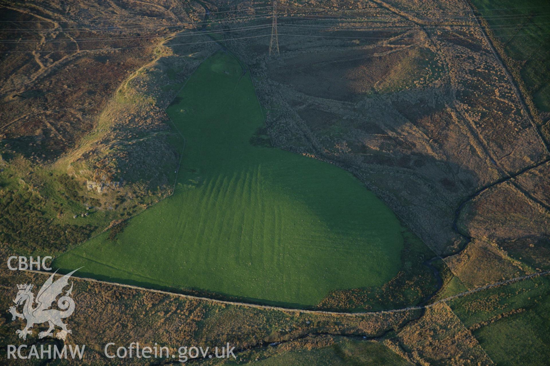 RCAHMW colour oblique aerial photograph of an enclosed hut settlement at Dolbelydr viewed from the south. Taken on 21 November 2005 by Toby Driver