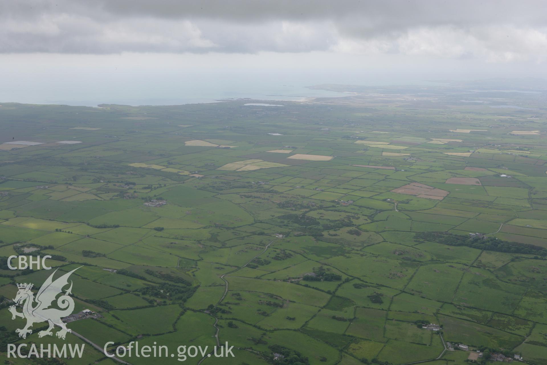 RCAHMW colour oblique photograph of view looking west over Din Dryfol Burial Chamber, towards Caernarfon Bay. Taken by Toby Driver on 13/06/2008.