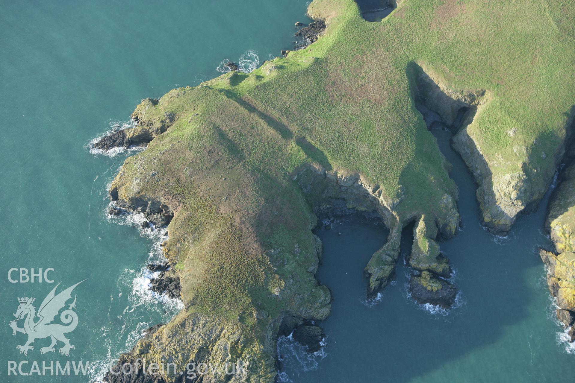 RCAHMW colour oblique photograph of South Castle Promontory fort, Skomer. Taken by Toby Driver on 04/03/2008.