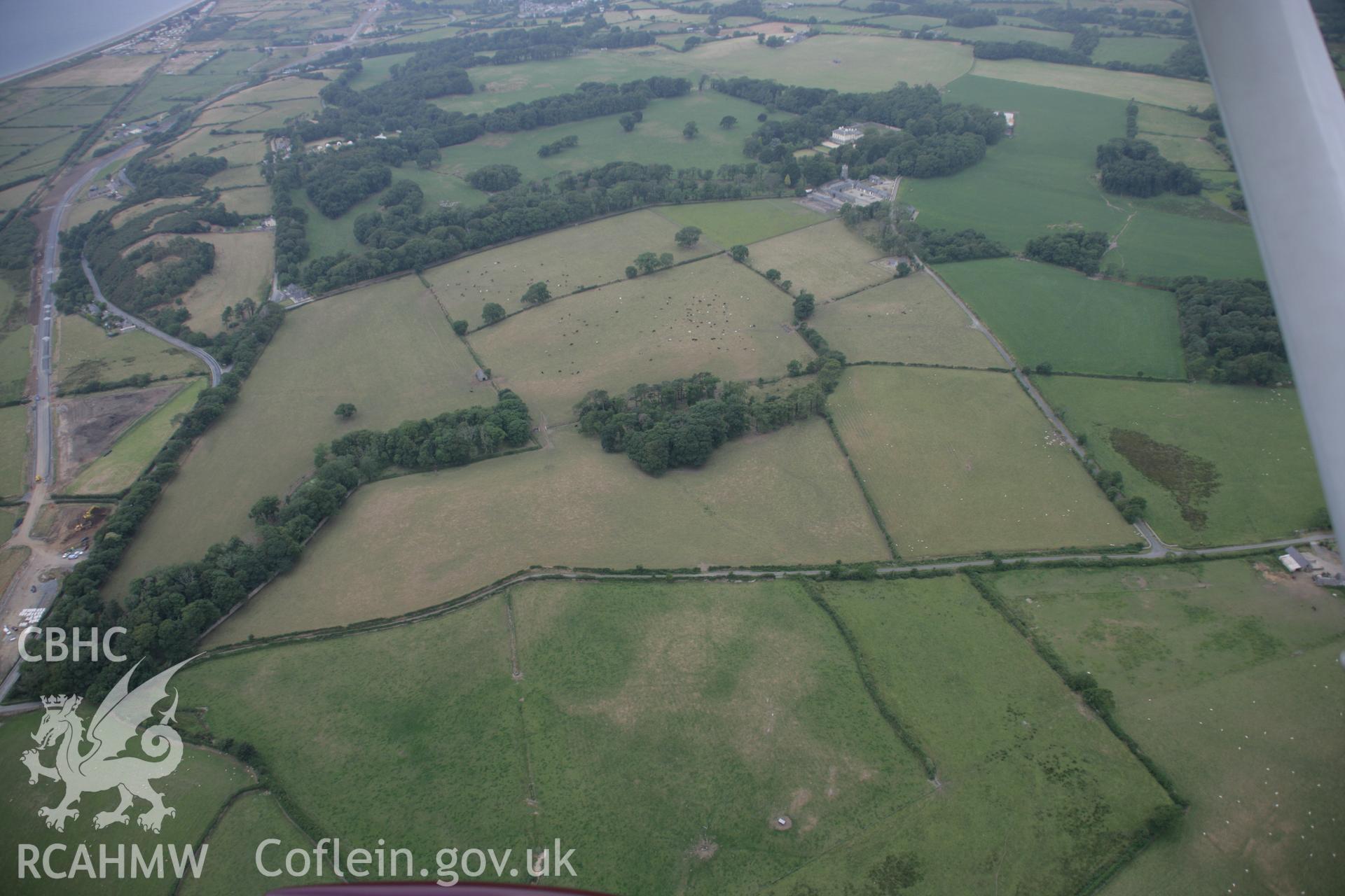 RCAHMW digital colour oblique photograph of the cropmark of a ring ditch at Penarth Fawr viewed from the east. Taken on 27/07/2005 by T.G. Driver.