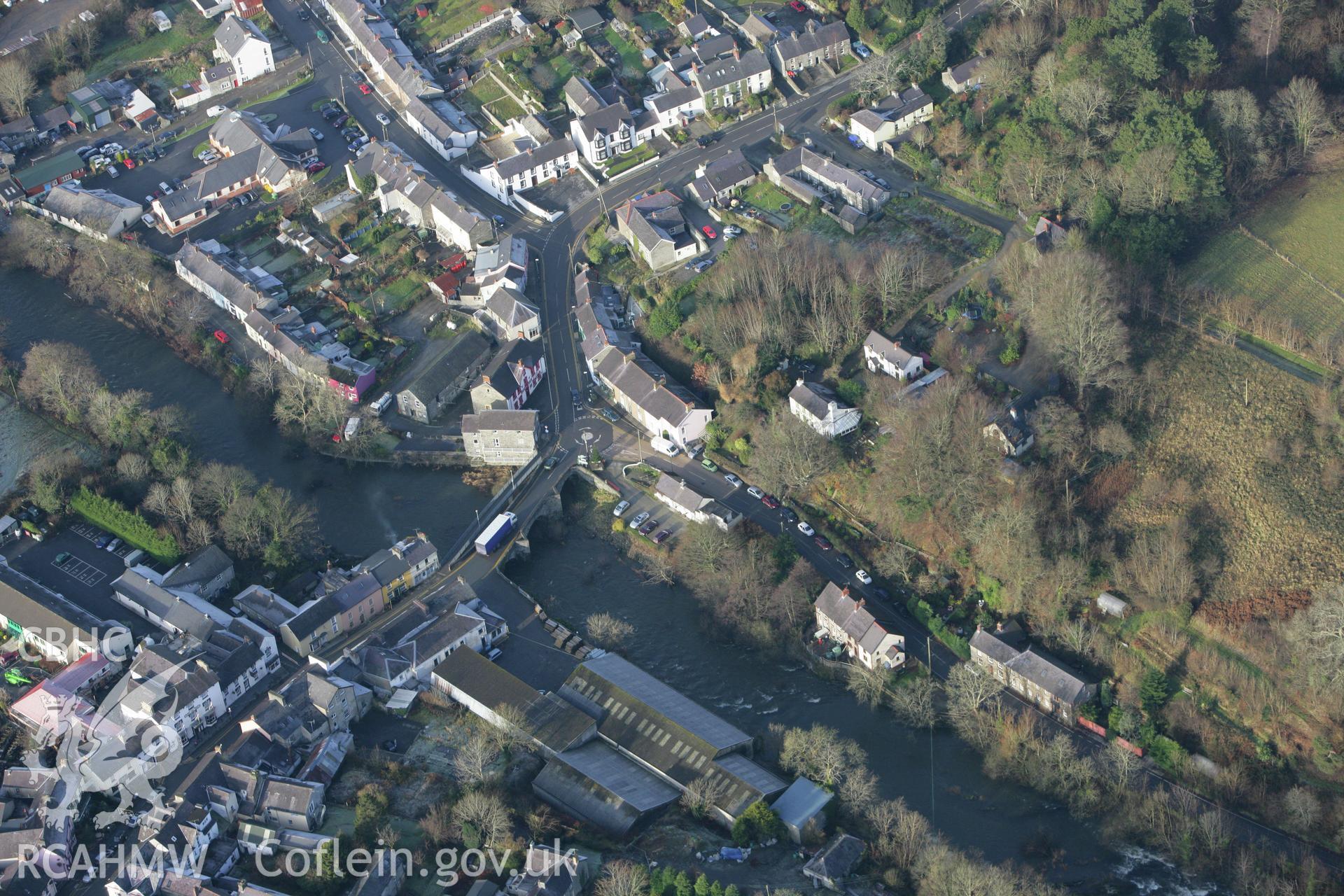 RCAHMW colour oblique photograph of Newcastle Emlyn Bridge and Adpar Motte. Taken by Toby Driver on 15/12/2008.