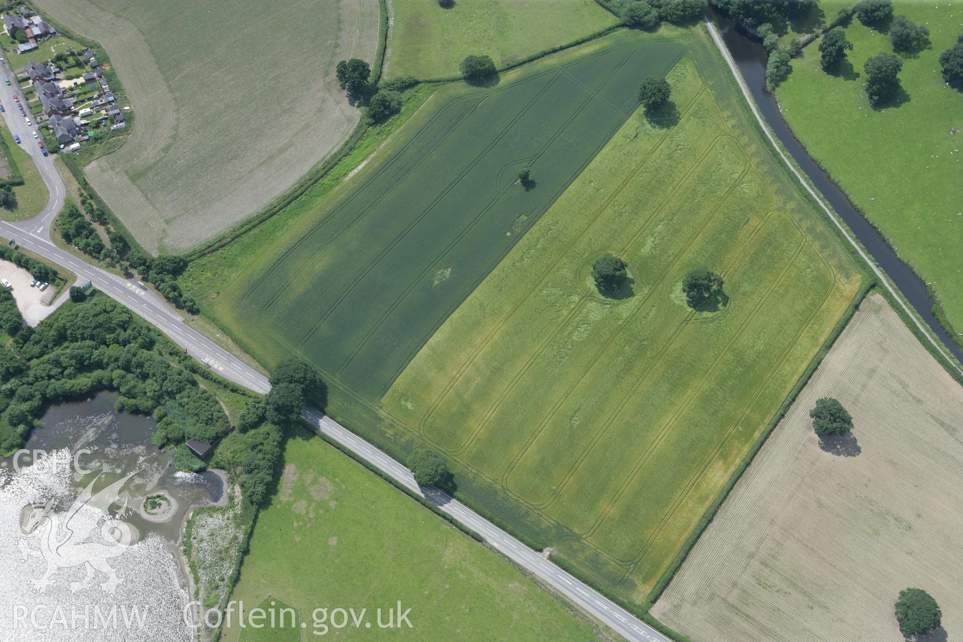 RCAHMW colour oblique photograph of Sarn-y-bryn Caled, parallel ditches. Taken by Toby Driver on 01/07/2008.