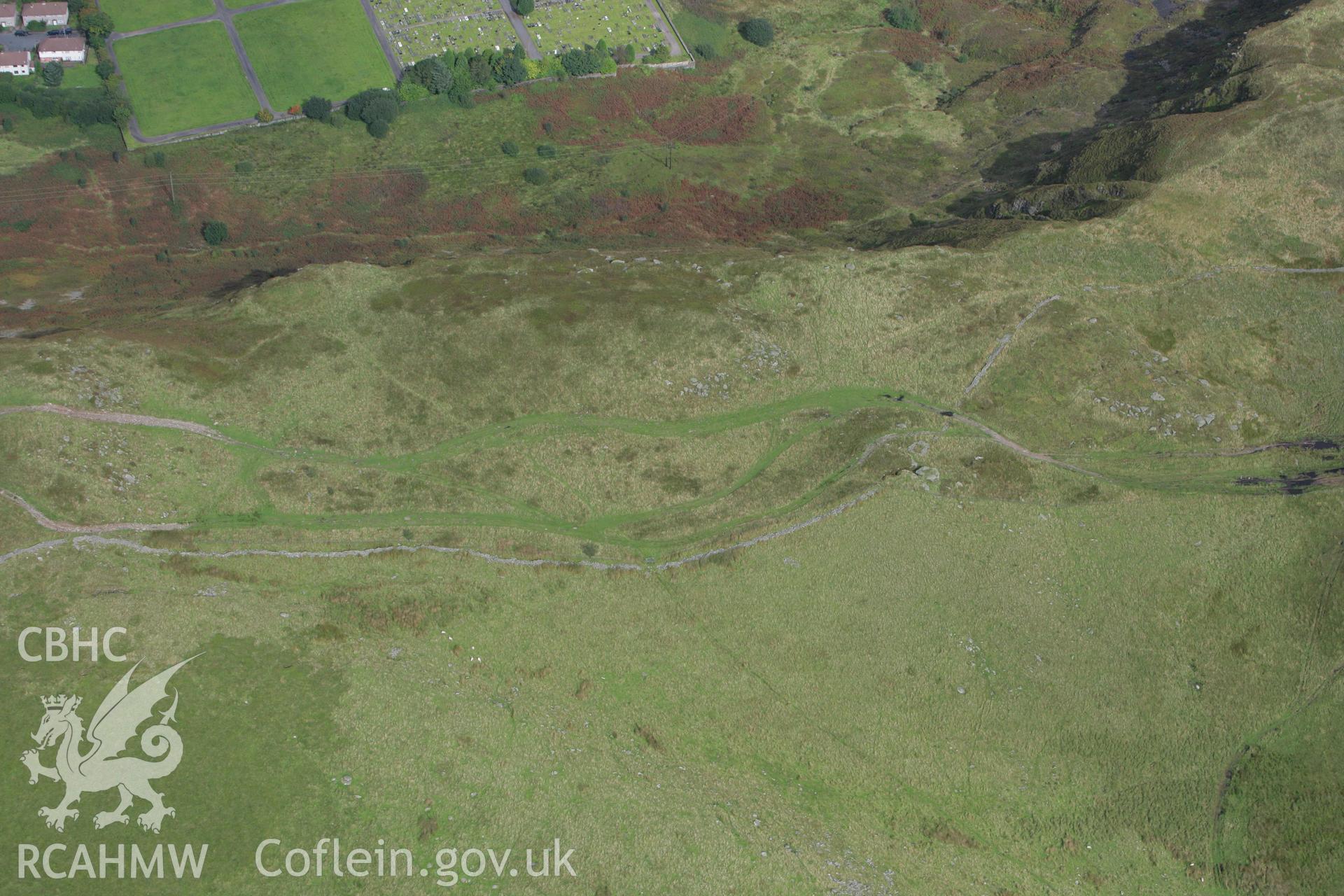 RCAHMW colour oblique photograph of Tarren Maerdy Cairn II, with sheep fold. Taken by Toby Driver on 12/09/2008.