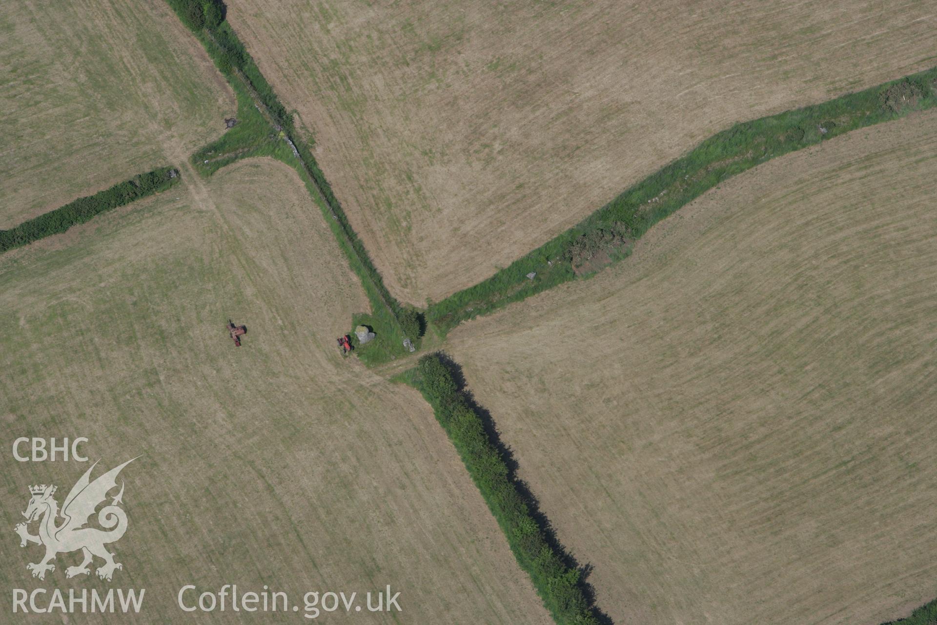 RCAHMW colour oblique photograph of Cromlech Farm Burial Chamber, Four Crosses. Taken by Toby Driver on 13/06/2008.