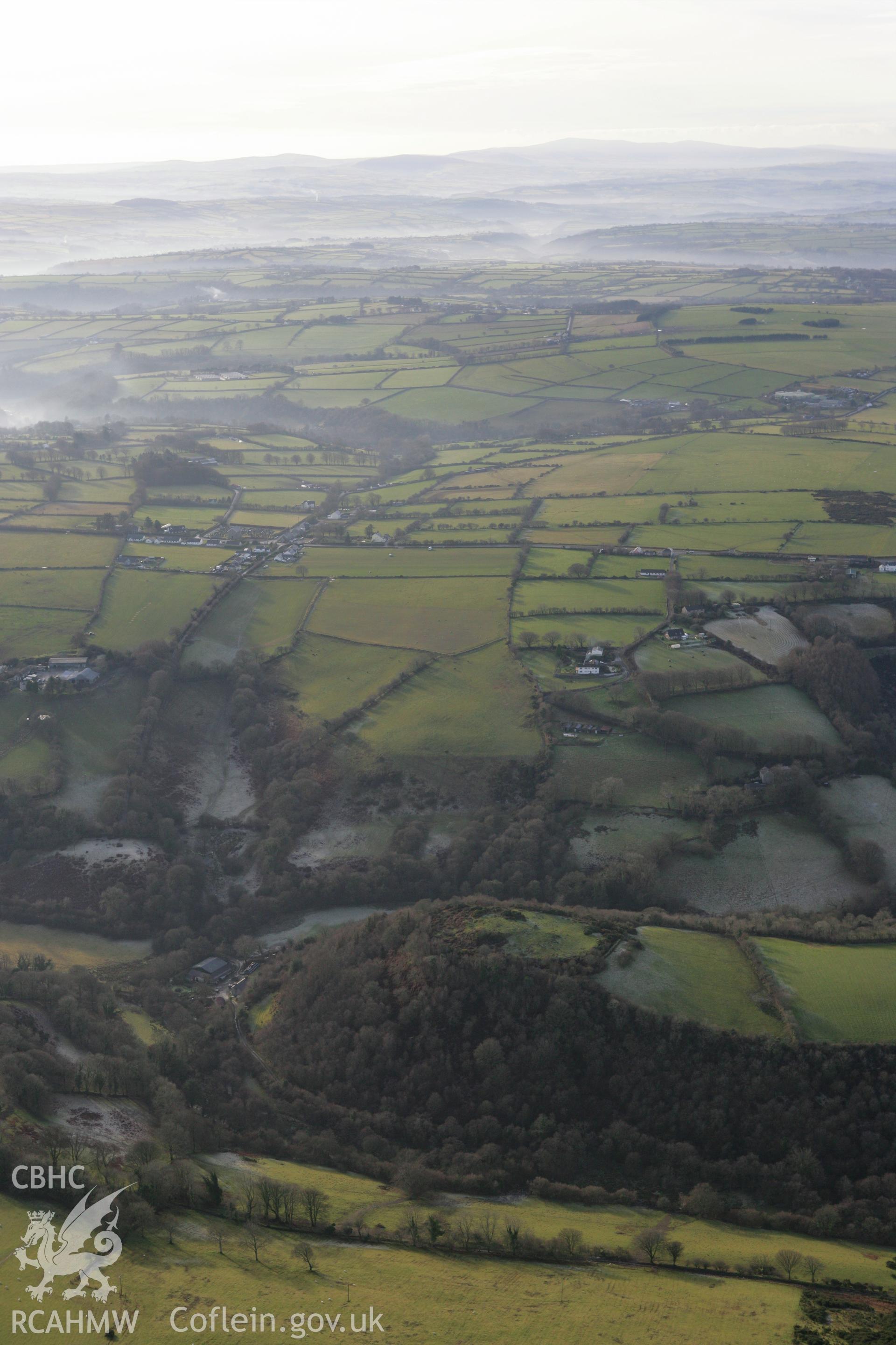 RCAHMW colour oblique photograph of Dinas Cerdin Hillfort. Taken by Toby Driver on 15/12/2008.