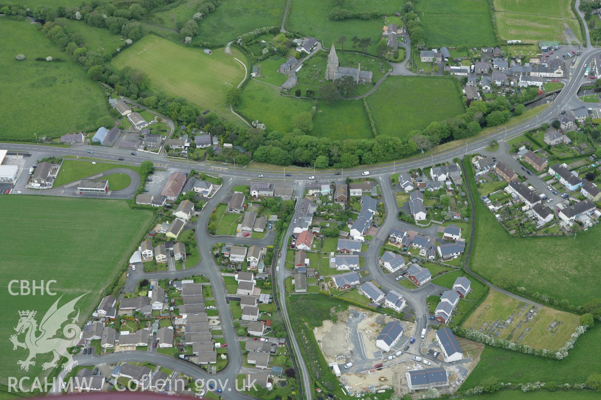 RCAHMW colour oblique photograph of Llanrhystud village, with St Rhystud's Church. Taken by Toby Driver on 20/05/2008.