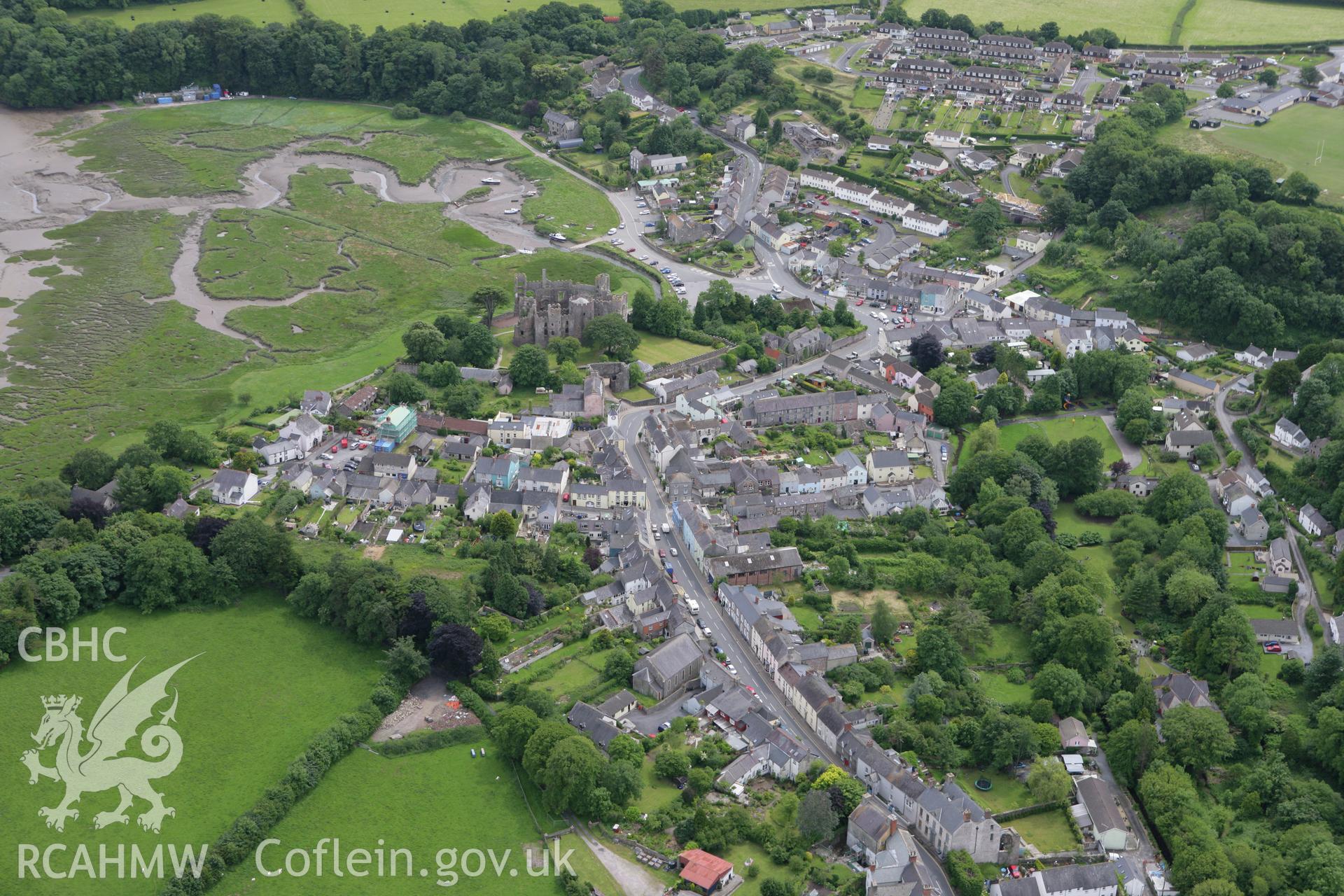 RCAHMW colour oblique photograph of Laugharne, view of town with Laugharne Castle. Taken by Toby Driver on 20/06/2008.