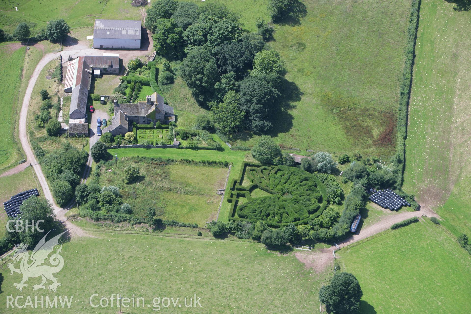 RCAHMW colour oblique photograph of Pen-y-clawdd Court Castle Mound. Taken by Toby Driver on 21/07/2008.