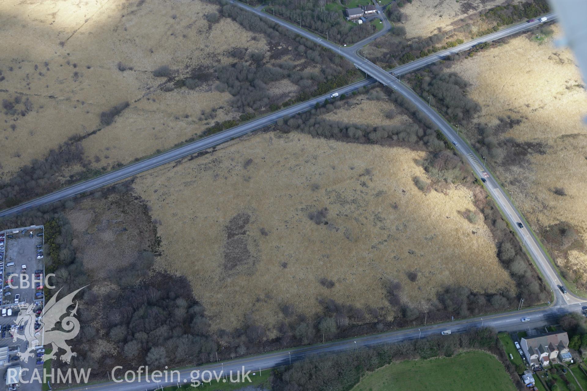 RCAHMW colour oblique photograph of Mynydd Carn Goch Roman Practice Camp. Taken by Toby Driver on 04/03/2008.