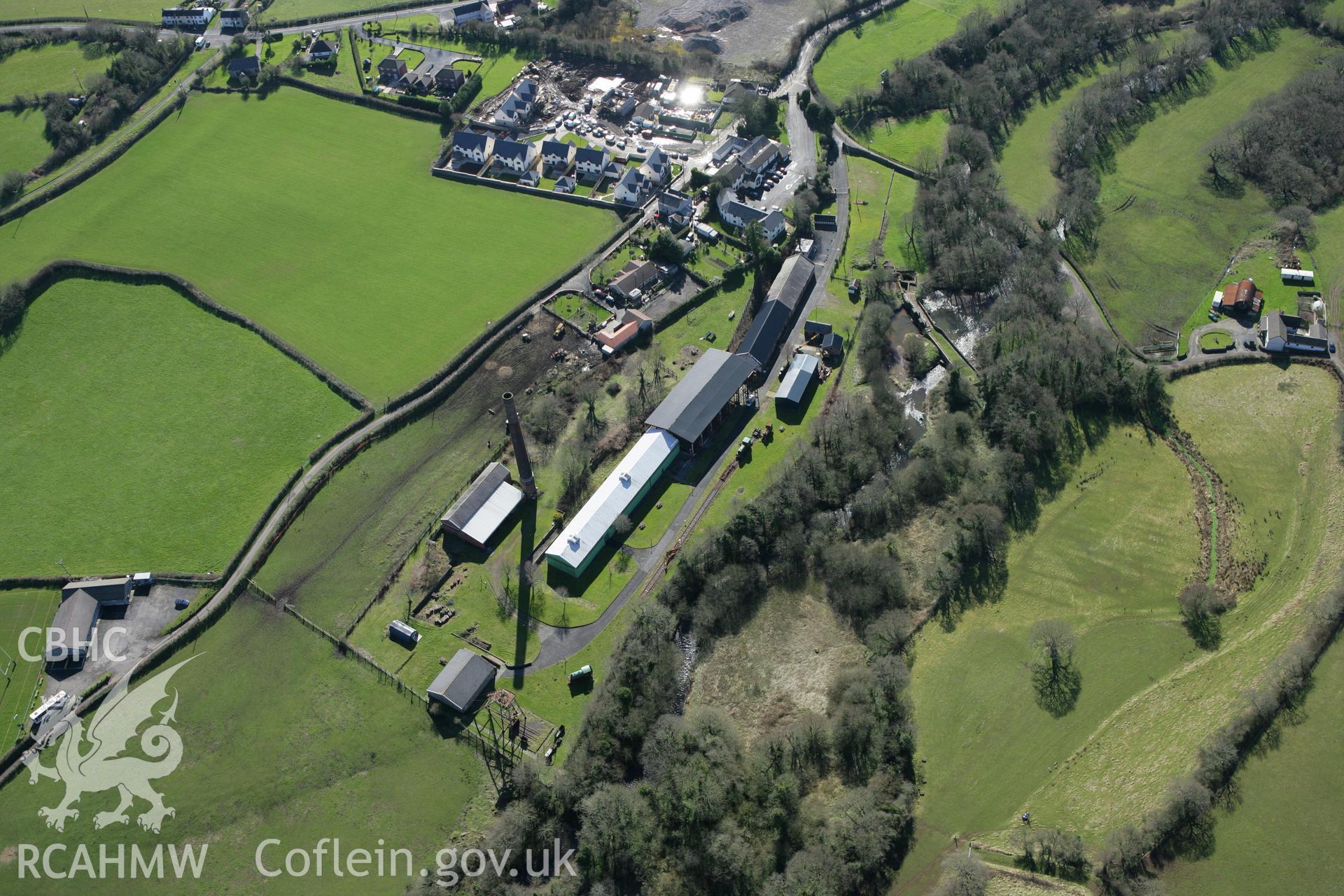 RCAHMW colour oblique photograph of Kidwelly Tinplate Works (Kidwelly Industrial Museum), showing sluices and dam. Taken by Toby Driver on 04/03/2008.