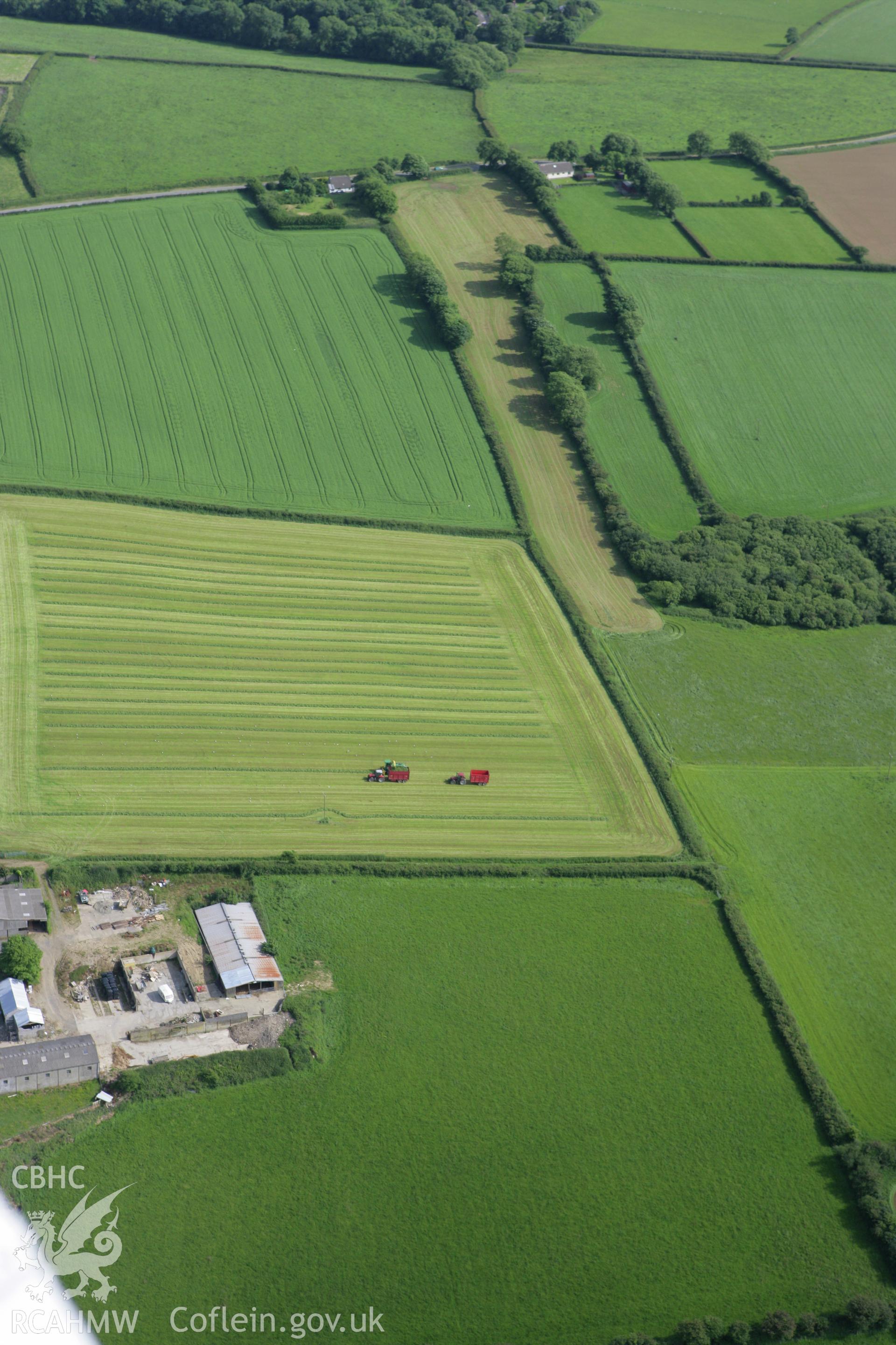 RCAHMW colour oblique photograph of harvesting in fields at Froghall, west of strip field system, Amblestone. Taken by Toby Driver on 13/06/2008.