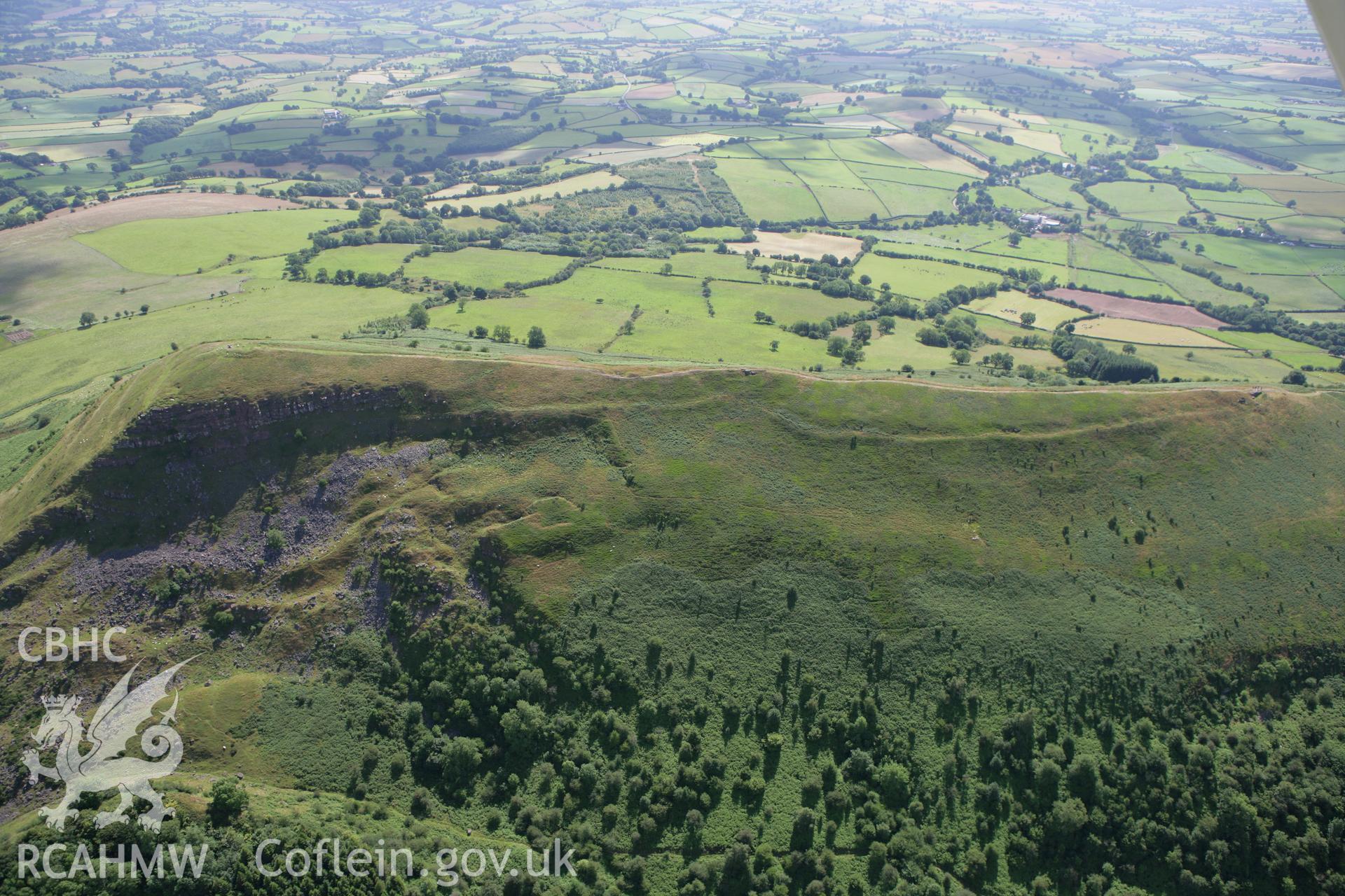 RCAHMW colour oblique photograph of Skirrid Fawr, remains of St Michael's Chapel and Skirrid Fawr Summit Enclosure, from the west. Taken by Toby Driver on 21/07/2008.