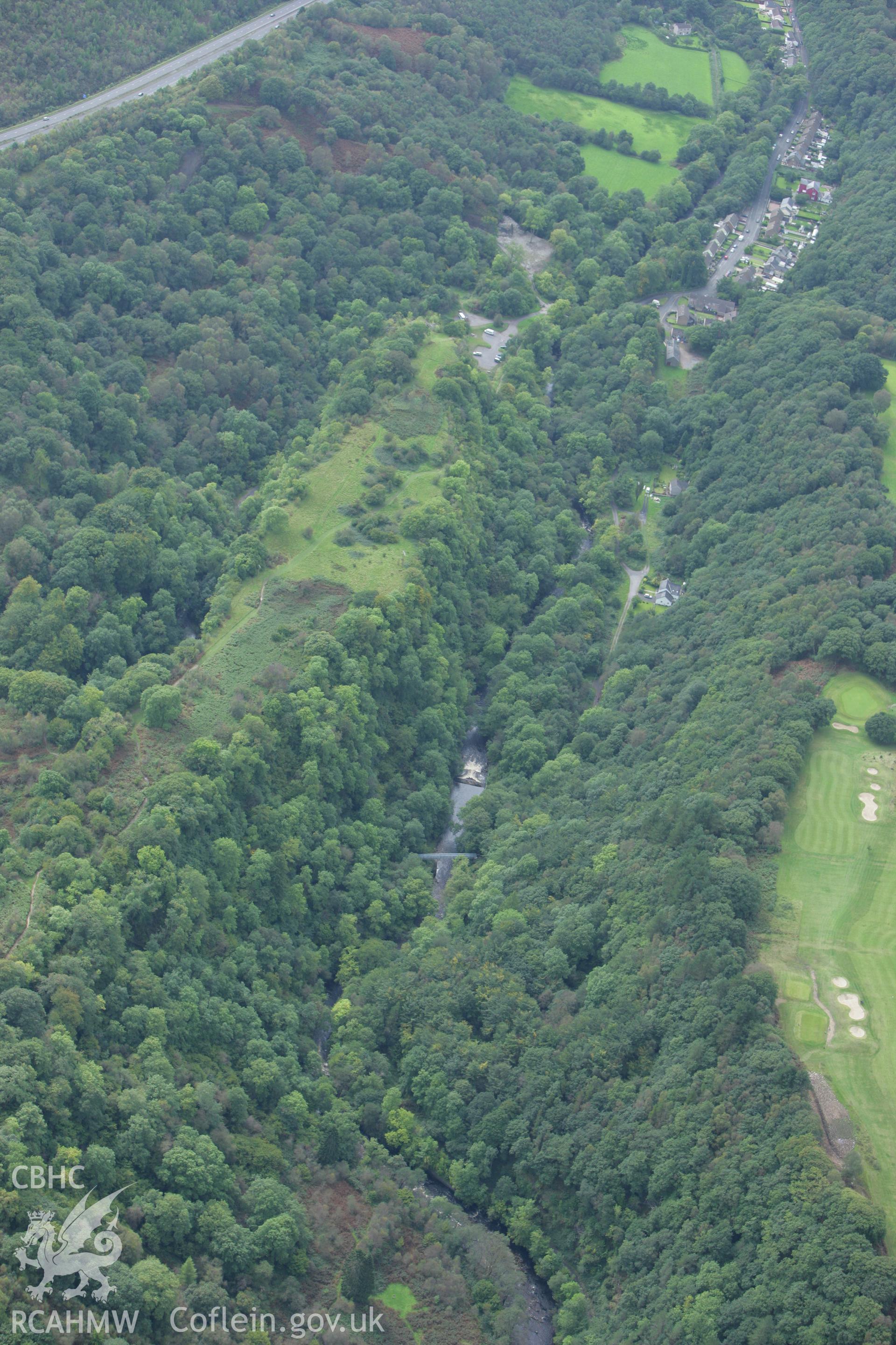 RCAHMW colour oblique photograph of Craig-y-Ddinas Promontory Fort, with Glyn Neath Black Powder Works, Pontneddfechan. Taken by Toby Driver on 12/09/2008.