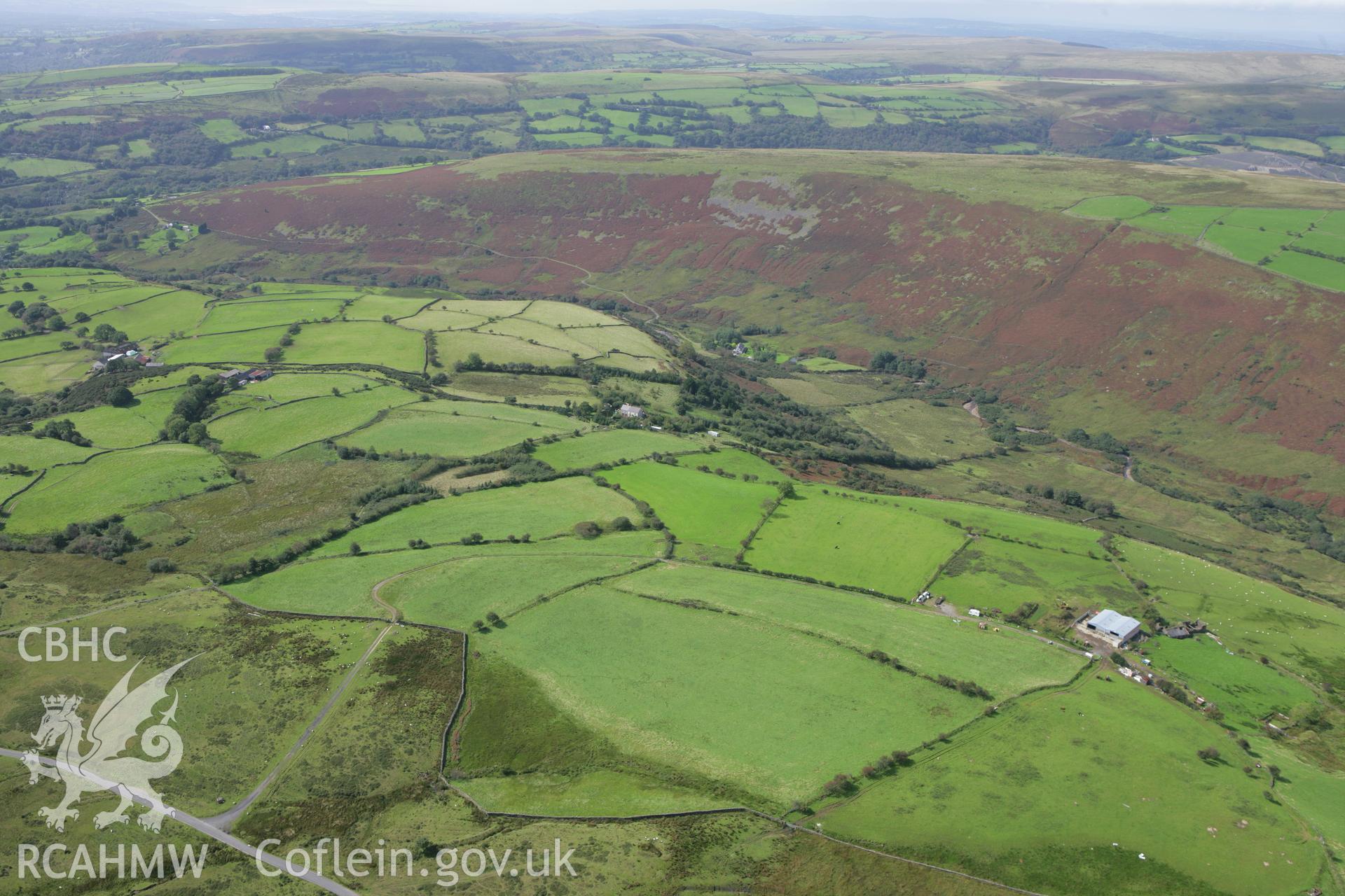 RCAHMW colour oblique photograph of Carn Lwyd, Llanguicke, looking west towards Mynydd y Garth. Taken by Toby Driver on 12/09/2008.