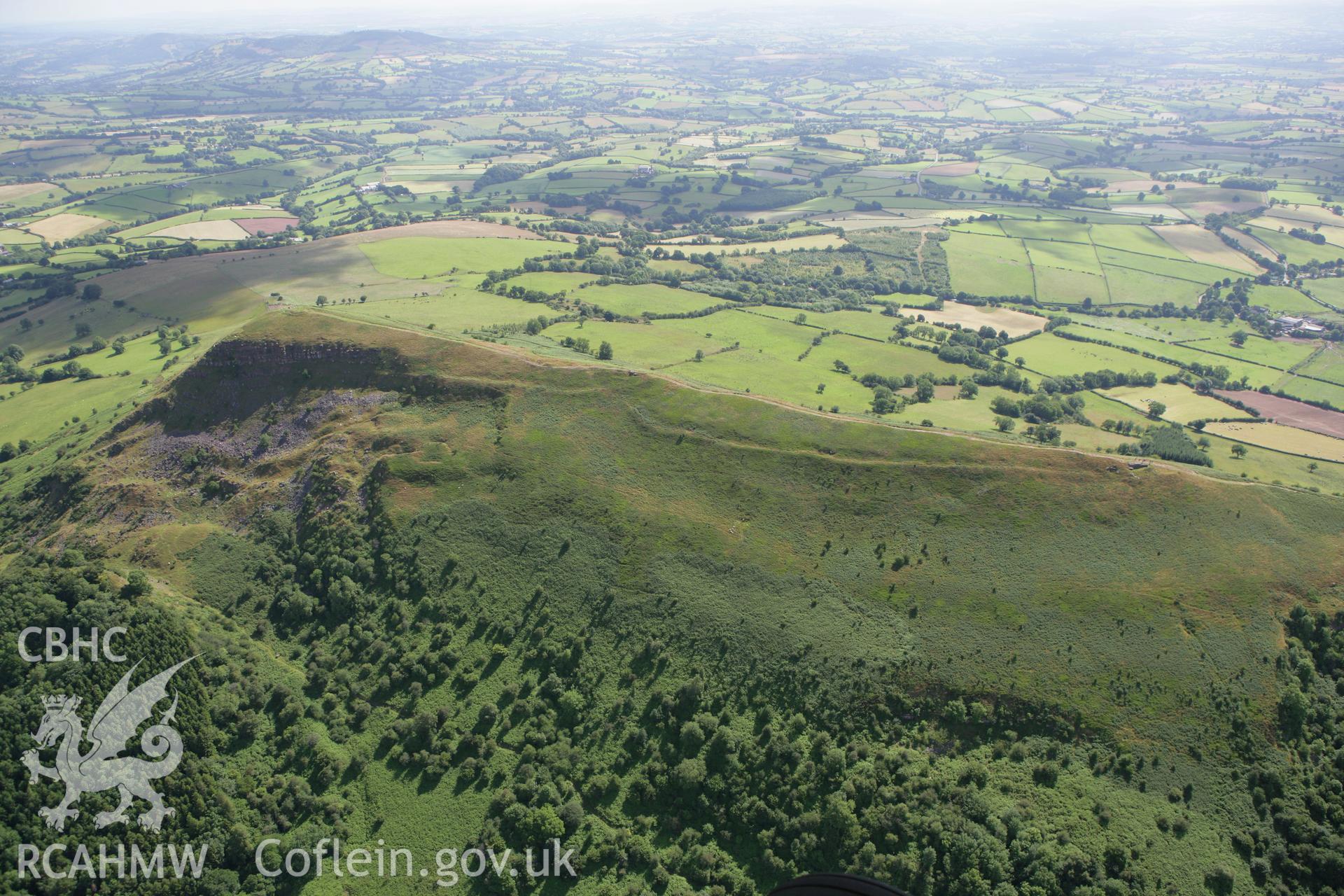 RCAHMW colour oblique photograph of Skirrid Fawr, remains of St Michael's Chapel and Skirrid Fawr Summit Enclosure, from the west. Taken by Toby Driver on 21/07/2008.