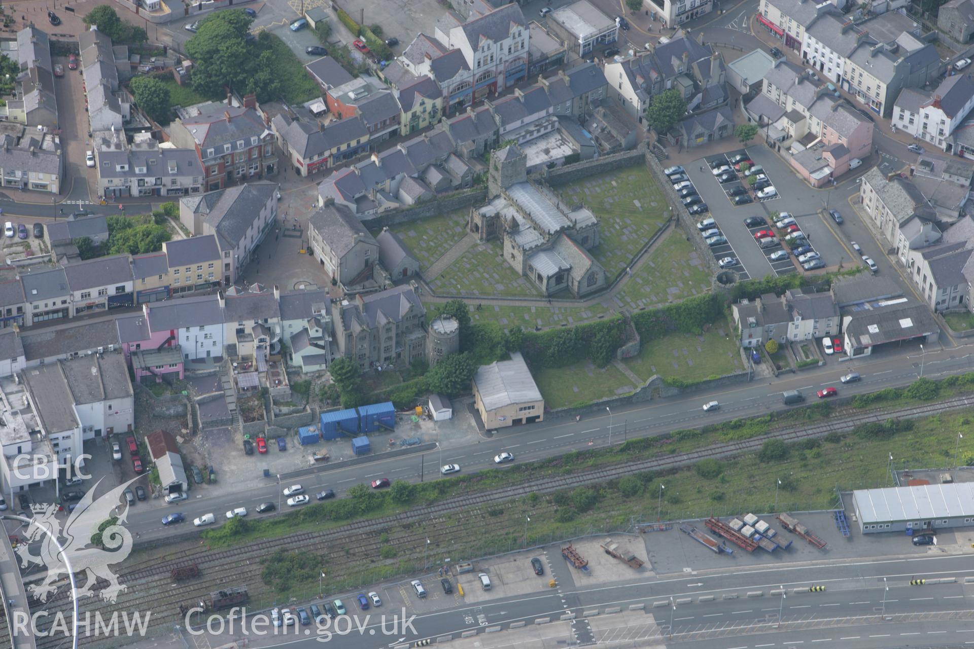 RCAHMW colour oblique photograph of Caer Gybi Roman Fort, later College Precinct, surrounding St Cybi's Church, Holyhead. Taken by Toby Driver on 13/06/2008.