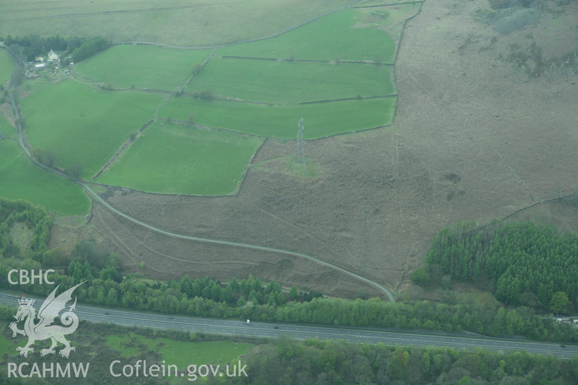 RCAHMW colour oblique photograph of Quarrying and trial workings, possibly house platforms associated with the quarrying on the slopes above Tair Gefail House, Glamorganshire Canal, Mount Pleasant. Taken by Toby Driver on 02/05/2008.