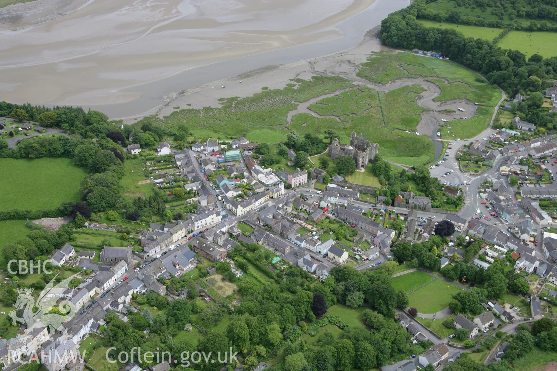 RCAHMW colour oblique photograph of Laugharne, view of town with Laugharne Castle. Taken by Toby Driver on 20/06/2008.