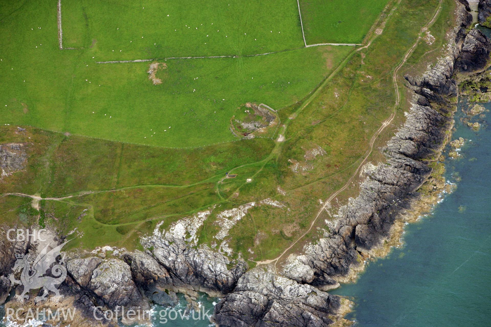 RCAHMW colour oblique photograph of Barclodiad y Gawres Burial Chamber, Anglesey. Taken by Toby Driver on 13/06/2008.