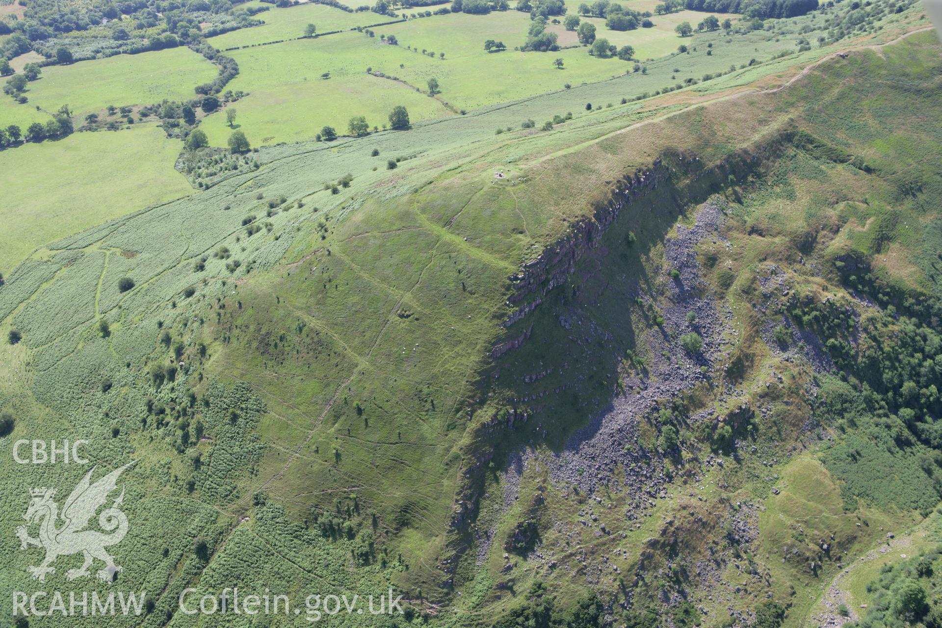 RCAHMW colour oblique photograph of Skirrid Fawr, remains of St Michael's Chapel and Skirrid Fawr Summit Enclosure, from the west. Taken by Toby Driver on 21/07/2008.