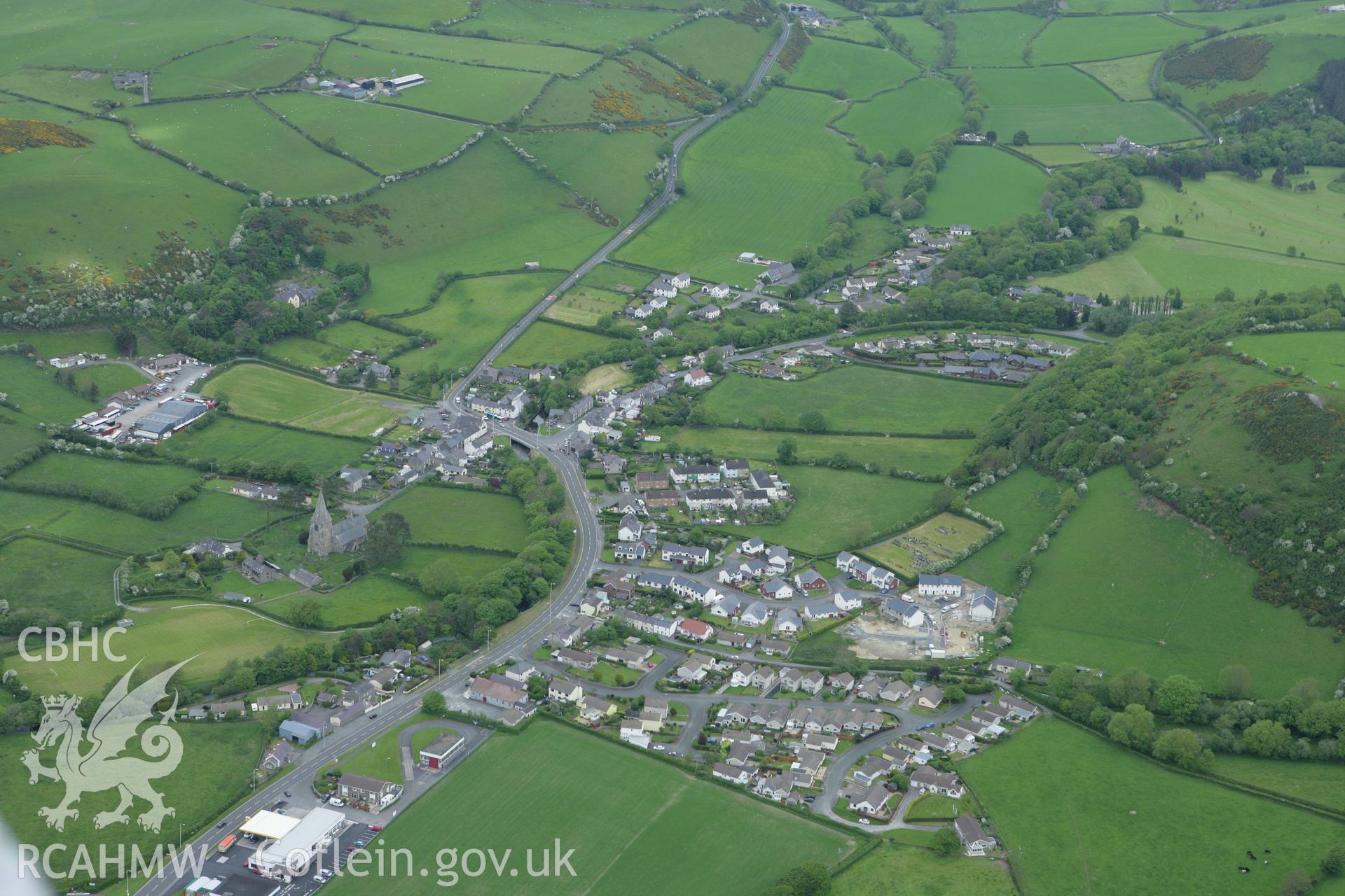 RCAHMW colour oblique photograph of Llanrhystud village, with St Rhystud's Church. Taken by Toby Driver on 20/05/2008.