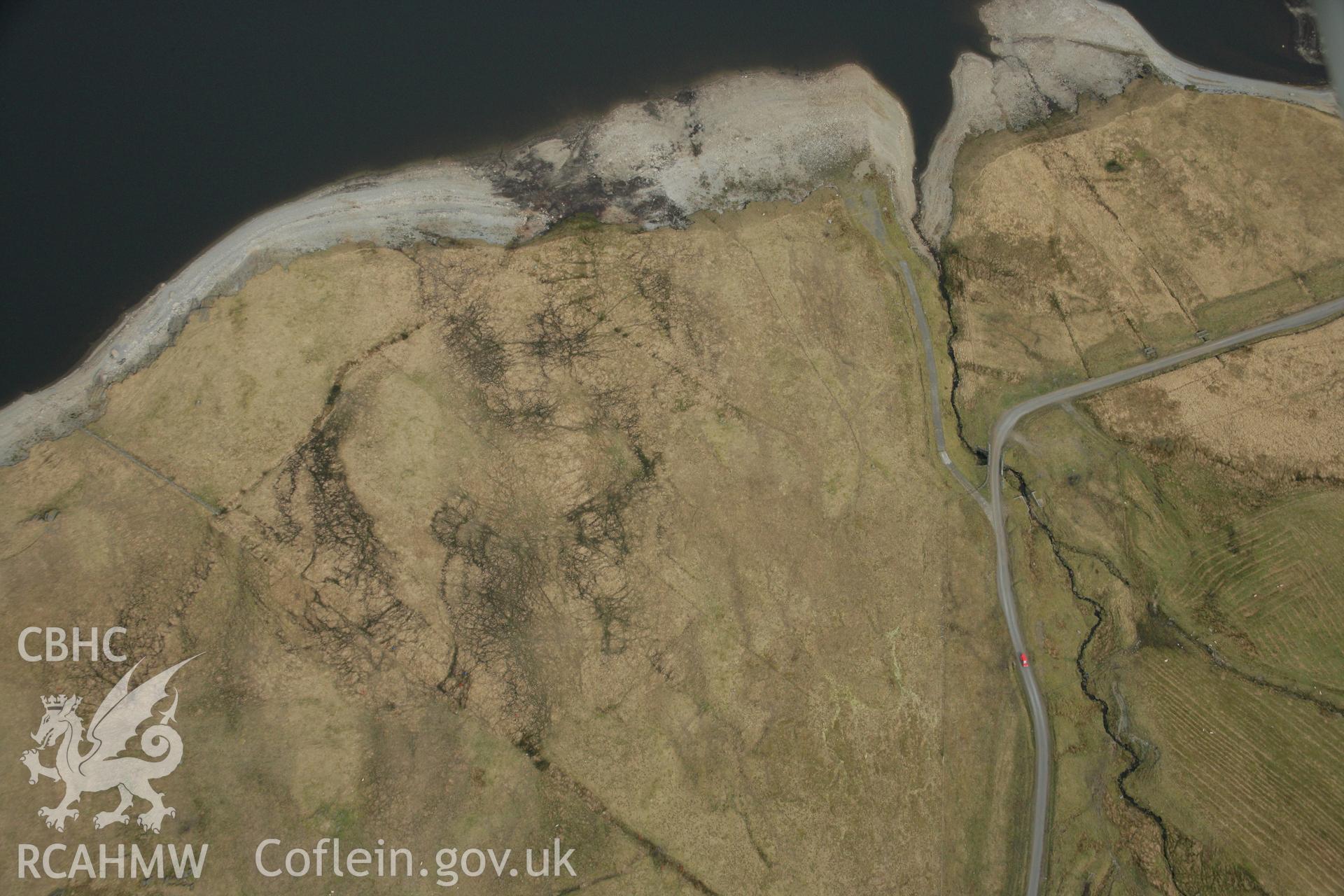 RCAHMW colour oblique aerial photograph of Nant Maesnant Fach Strauctured Round Cairn. Taken on 17 April 2007 by Toby Driver