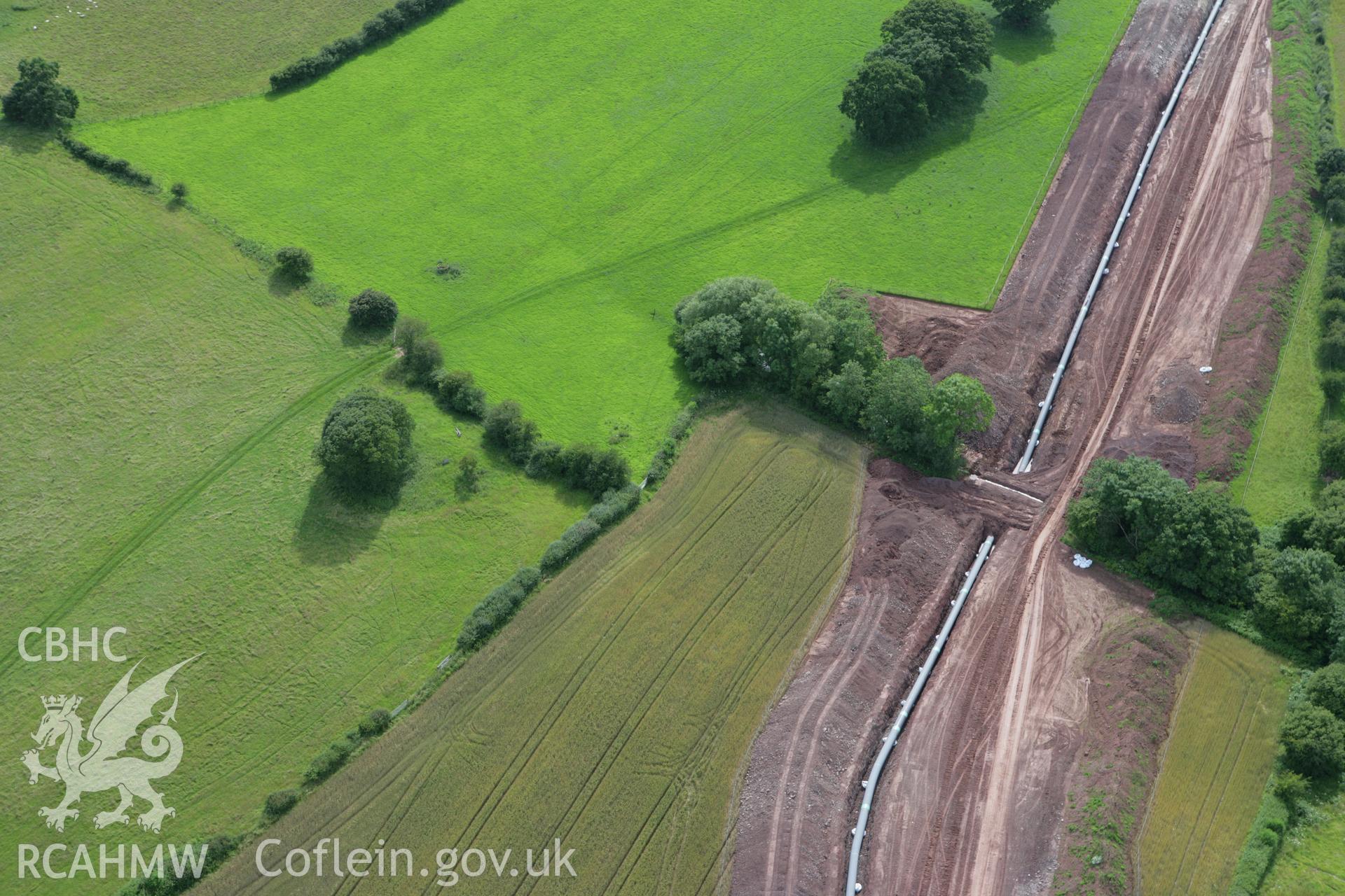 RCAHMW colour oblique aerial photograph of Pipton Chambered Long Cairn. Taken on 09 July 2007 by Toby Driver