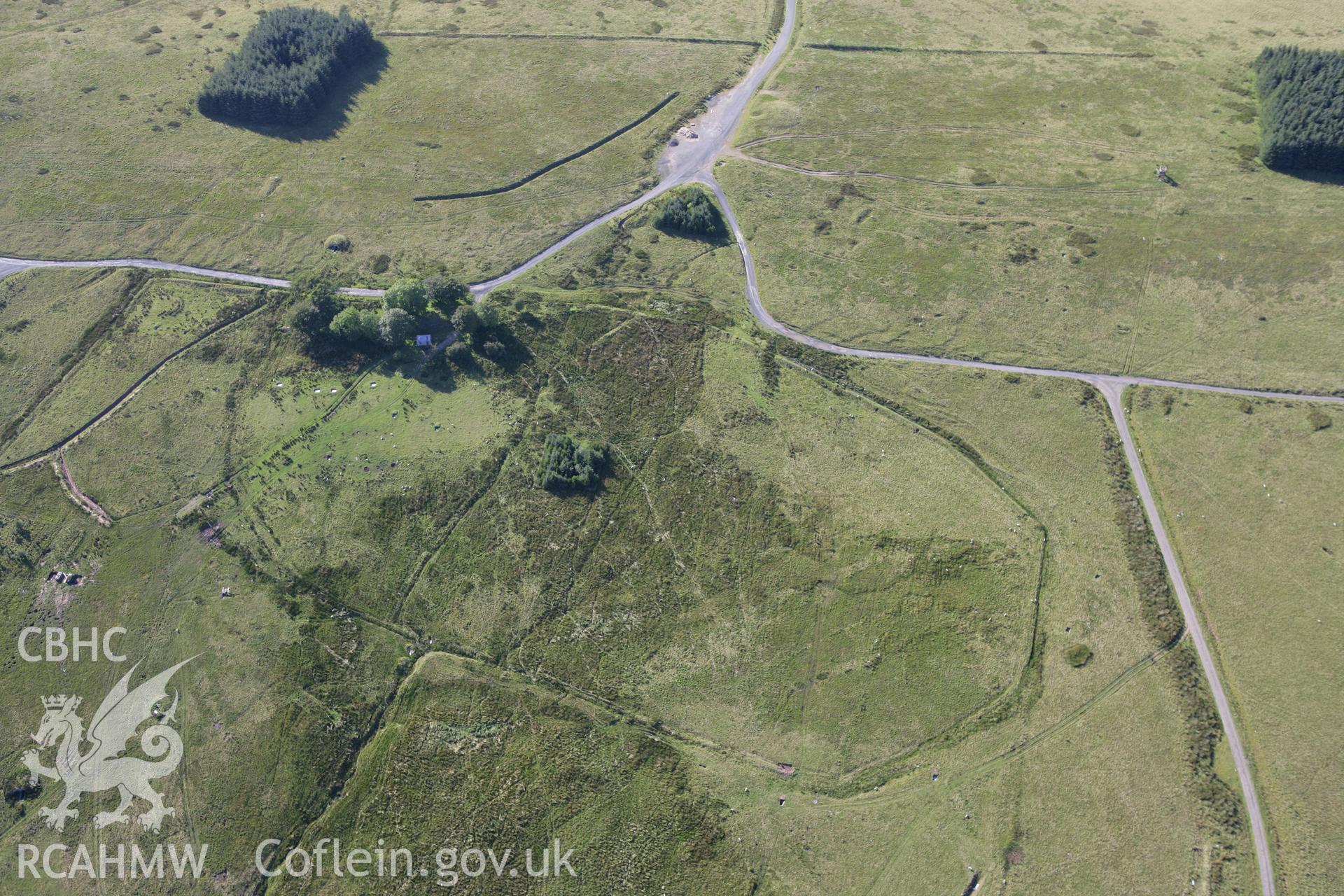 RCAHMW colour oblique aerial photograph of Ffynnon Dafydd Befan Cairn I. Taken on 08 August 2007 by Toby Driver