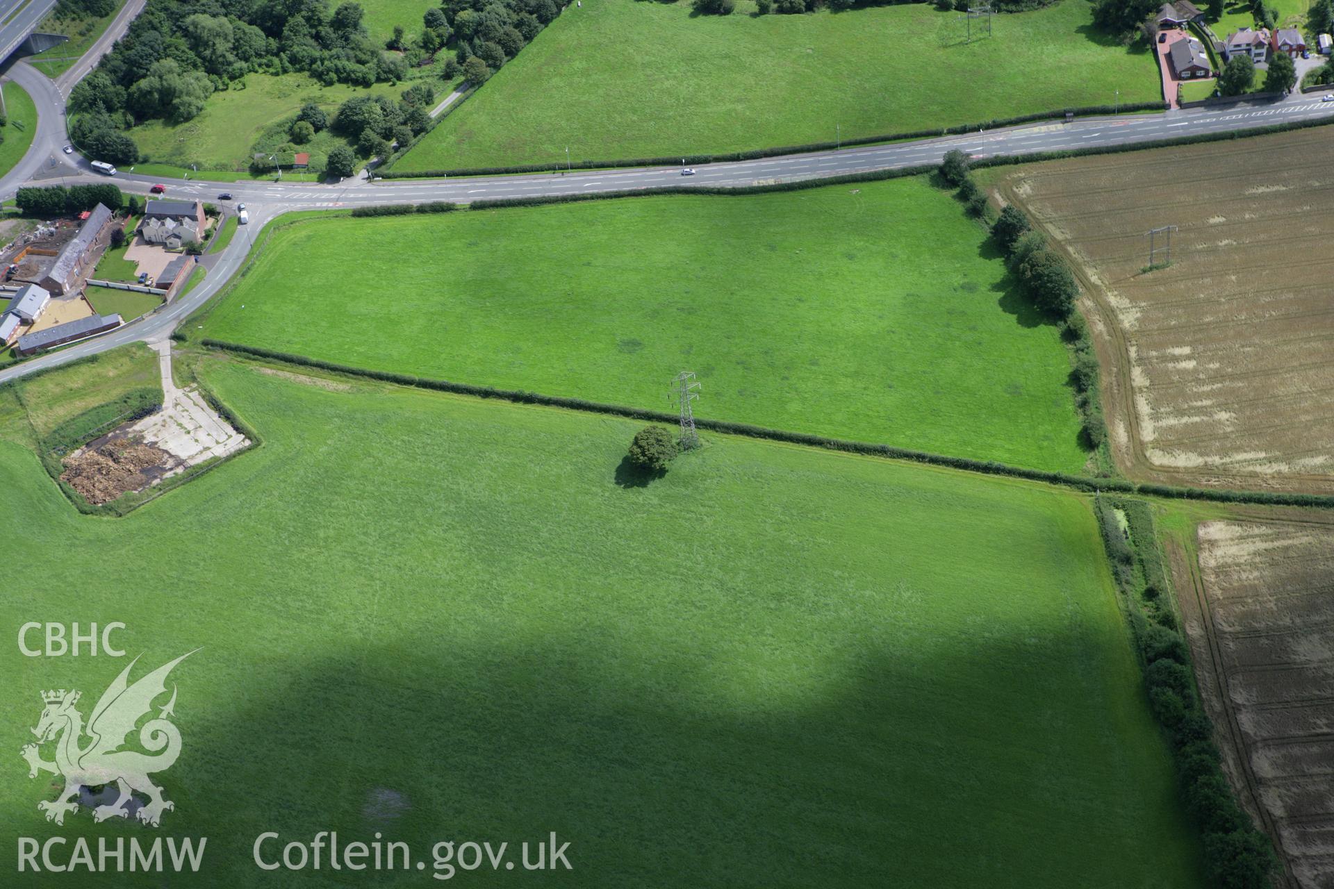 RCAHMW colour oblique aerial photograph of Croes-Foel Barrow. Taken on 24 July 2007 by Toby Driver