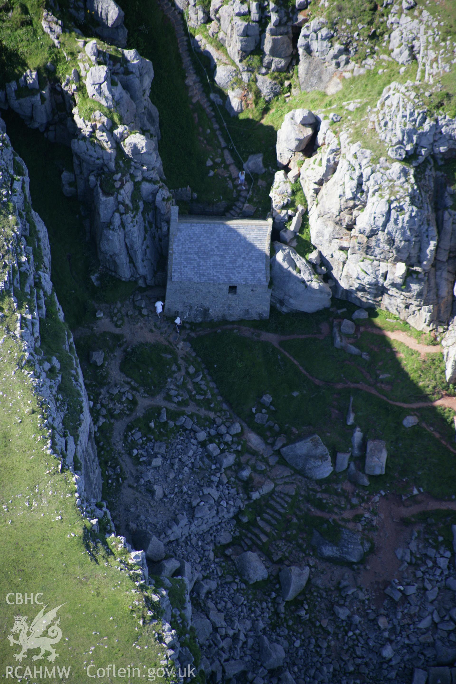 RCAHMW colour oblique aerial photograph of St Govan's Chapel. Taken on 30 July 2007 by Toby Driver