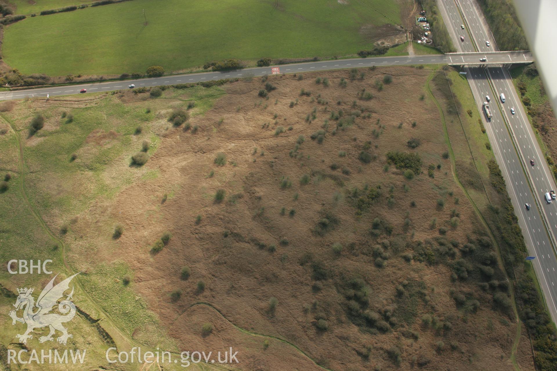 RCAHMW colour oblique aerial photograph of Croes y Ddadl Enclosure. Taken on 16 March 2007 by Toby Driver