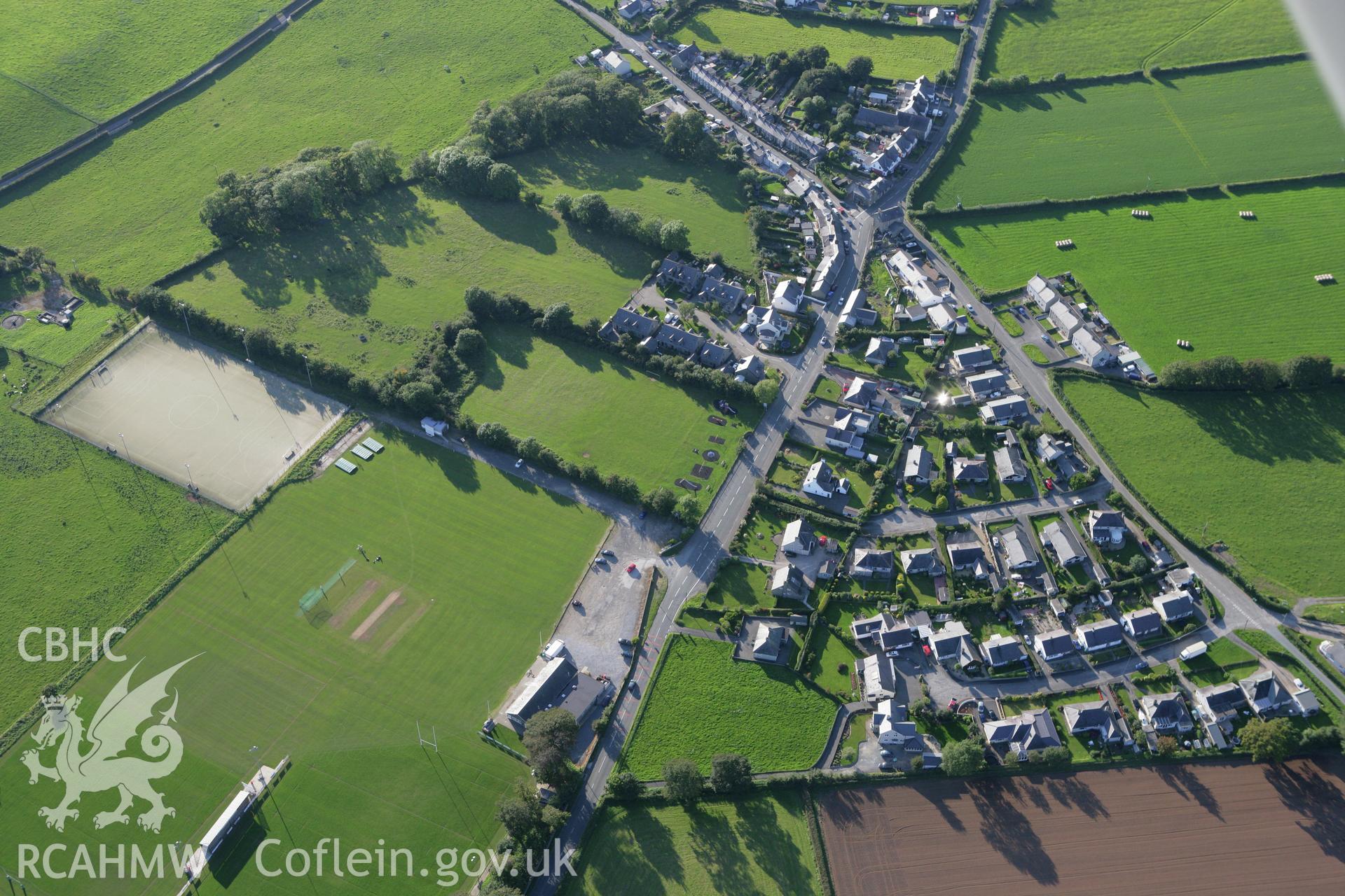 RCAHMW colour oblique aerial photograph of King George's Field Enclosure at Efailnewydd. Taken on 06 September 2007 by Toby Driver