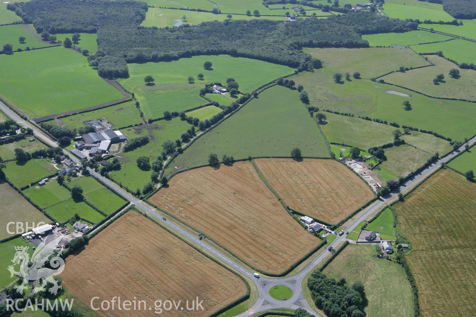 RCAHMW colour oblique aerial photograph of a section of Offa's Dyke, or Whitford Dyke, northwest and southeast of Brynbella Mound. Taken on 31 July 2007 by Toby Driver