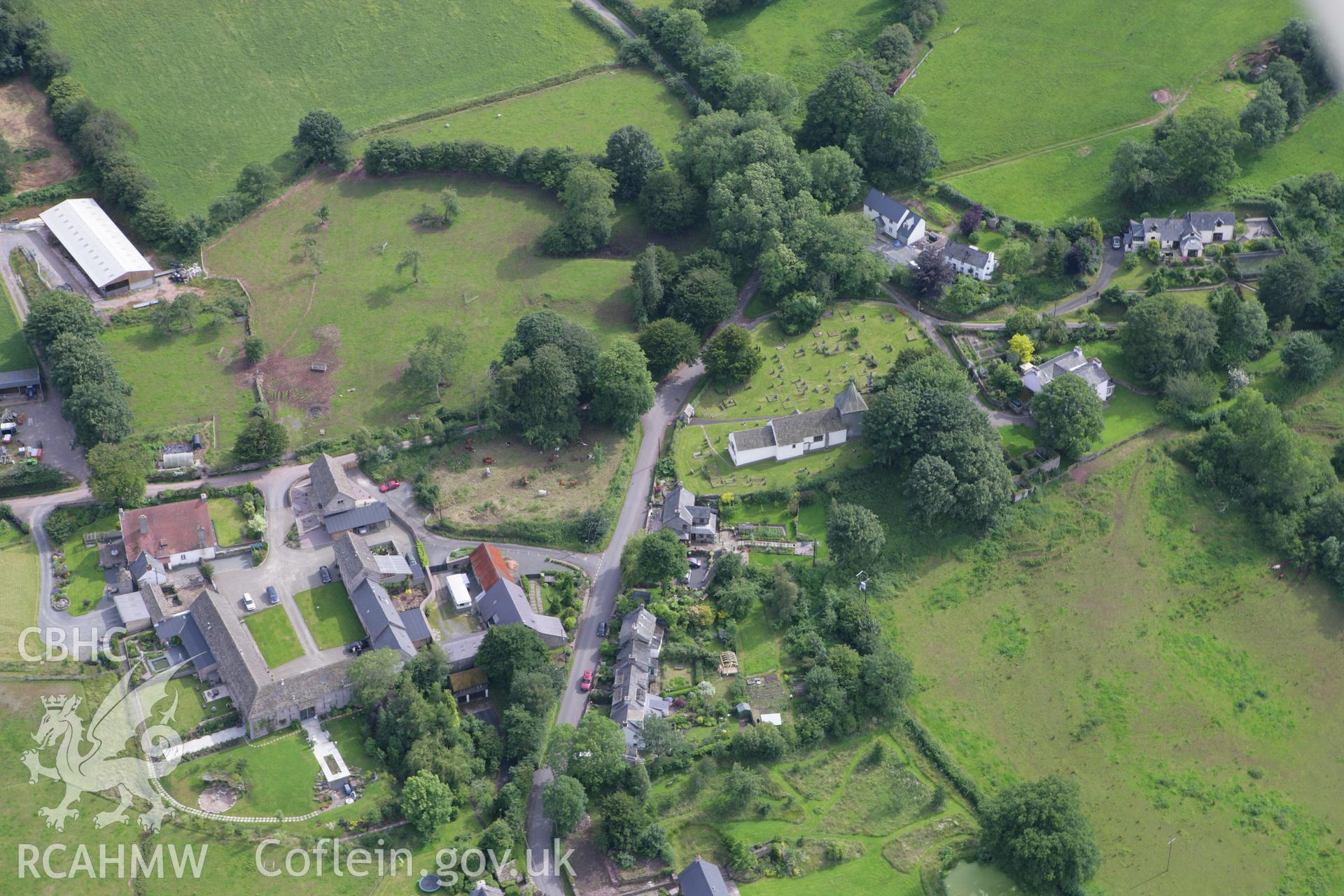 RCAHMW colour oblique aerial photograph of Llanfilo Moat II. Taken on 09 July 2007 by Toby Driver