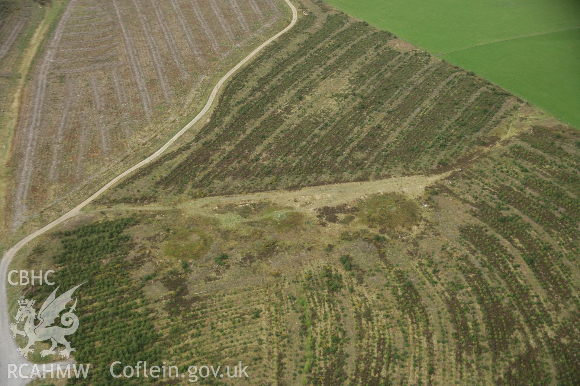 RCAHMW colour oblique aerial photograph of Trichrug Barrows. Taken on 17 April 2007 by Toby Driver