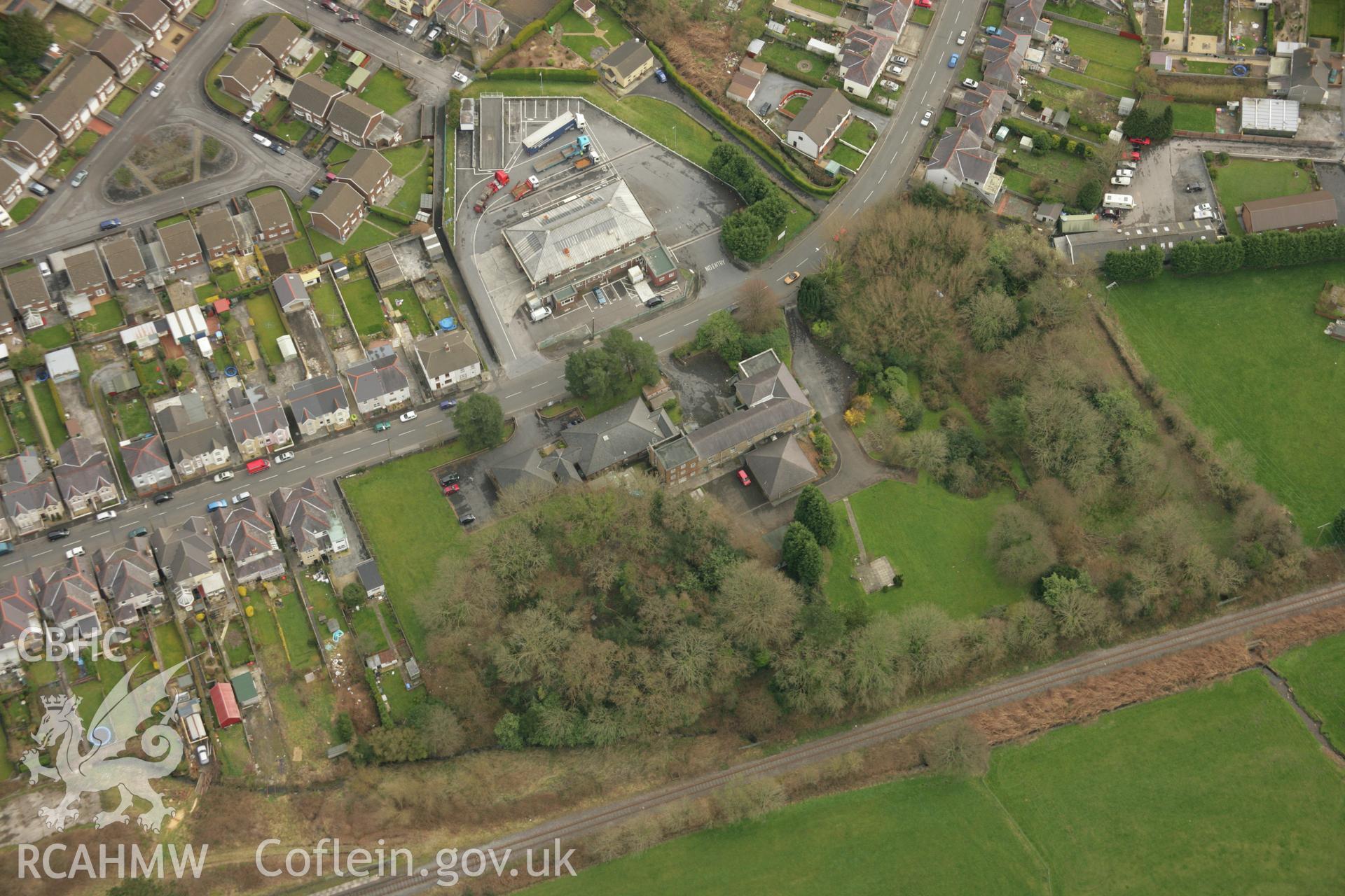 RCAHMW colour oblique aerial photograph of Tir-y-Dail Motte and Bailey, Ammanford, Rhydaman. Taken on 16 March 2007 by Toby Driver