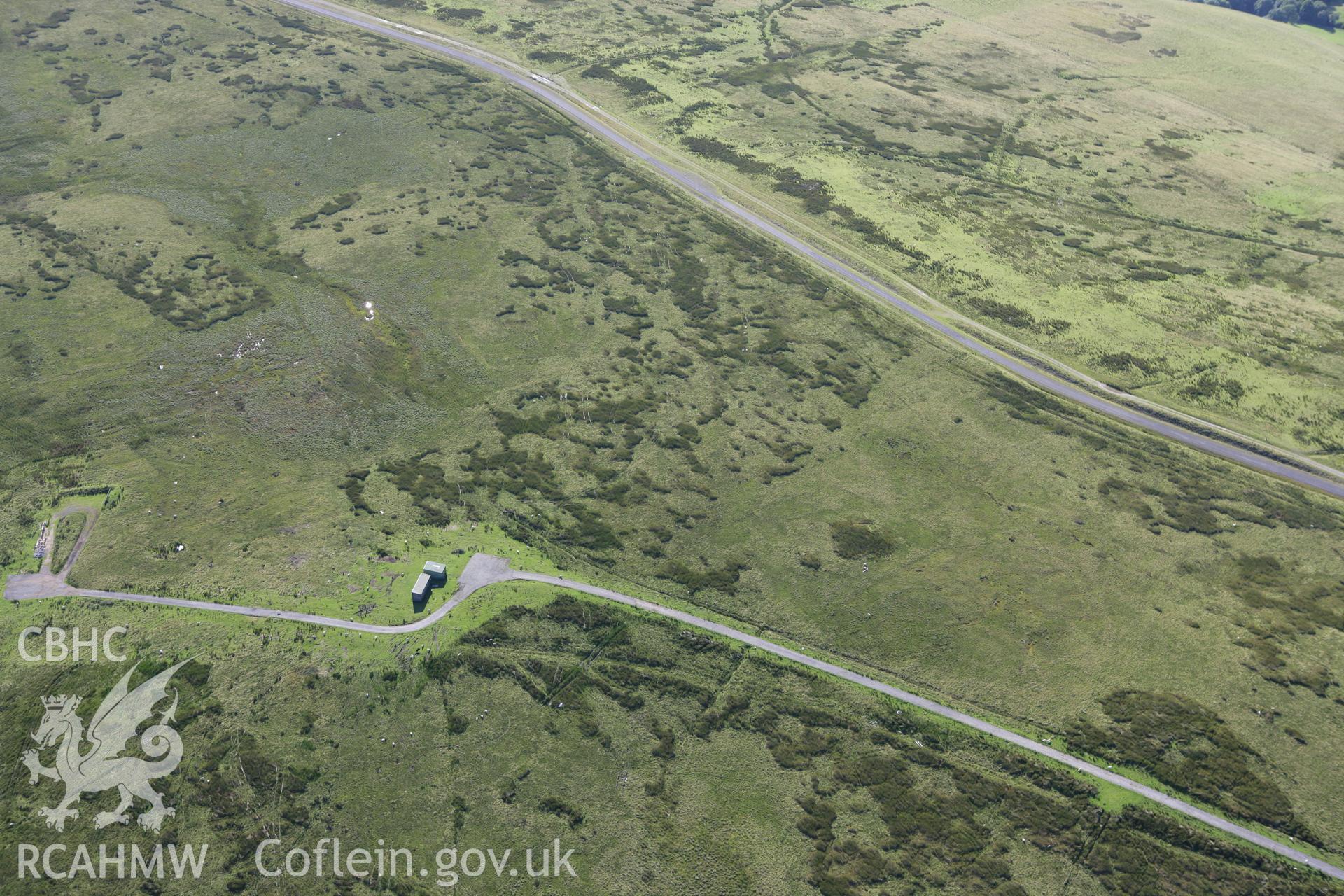 RCAHMW colour oblique aerial photograph of Troed-y-Rhiw Isaf Cairn I and II. Taken on 08 August 2007 by Toby Driver