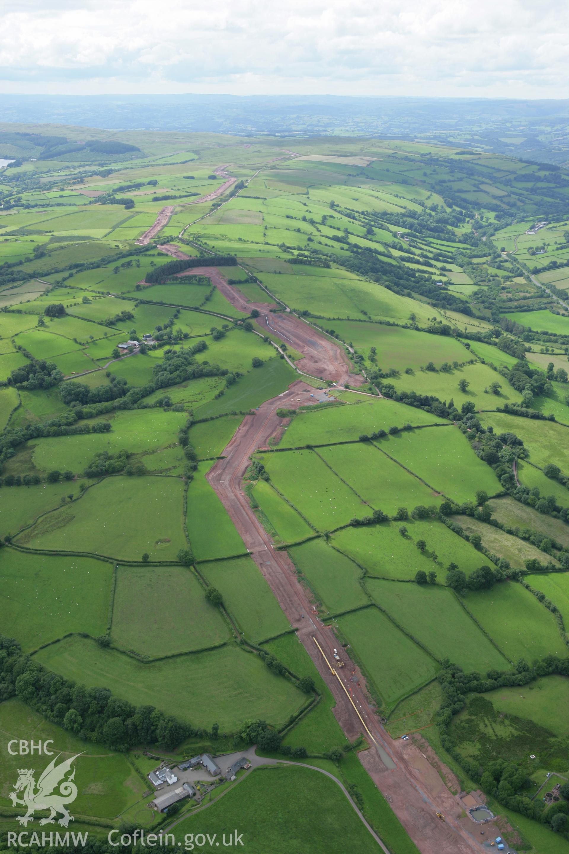 RCAHMW colour oblique aerial photograph of Trecastle with the LNG pipeline passing to the south. Taken on 09 July 2007 by Toby Driver