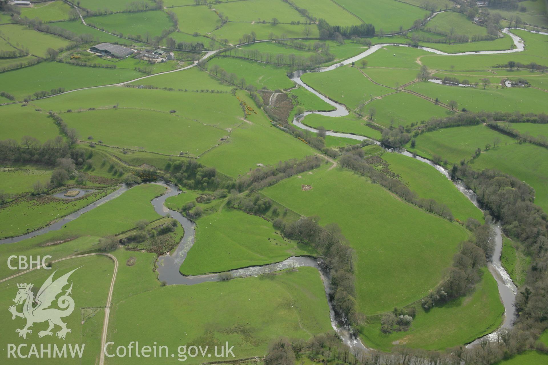 RCAHMW colour oblique aerial photograph of Pont Llanio Railway Station and disused track. Taken on 17 April 2007 by Toby Driver