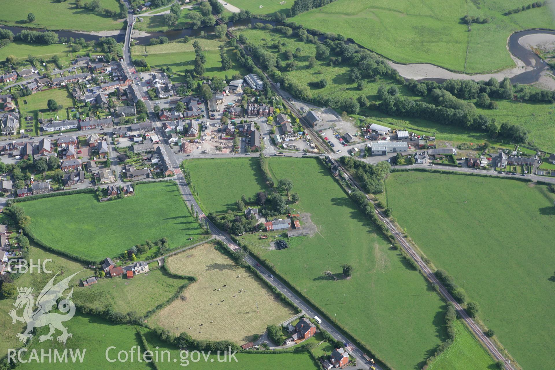 RCAHMW colour oblique aerial photograph of Caersws Roman Military Settlement. Taken on 06 September 2007 by Toby Driver