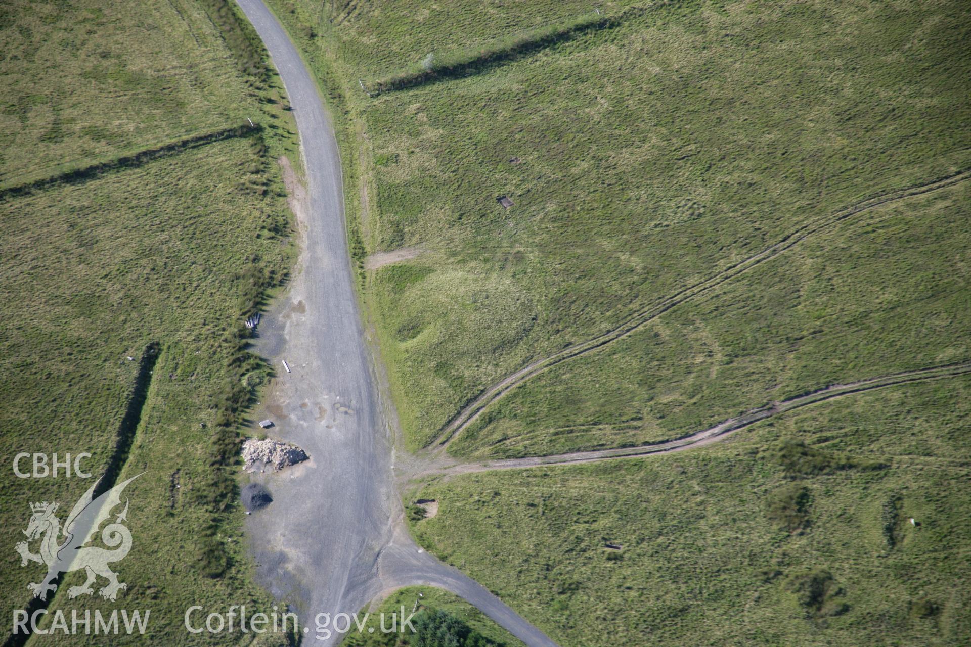 RCAHMW colour oblique aerial photograph of Ffynnon Dafydd Befan Cairn I. Taken on 08 August 2007 by Toby Driver