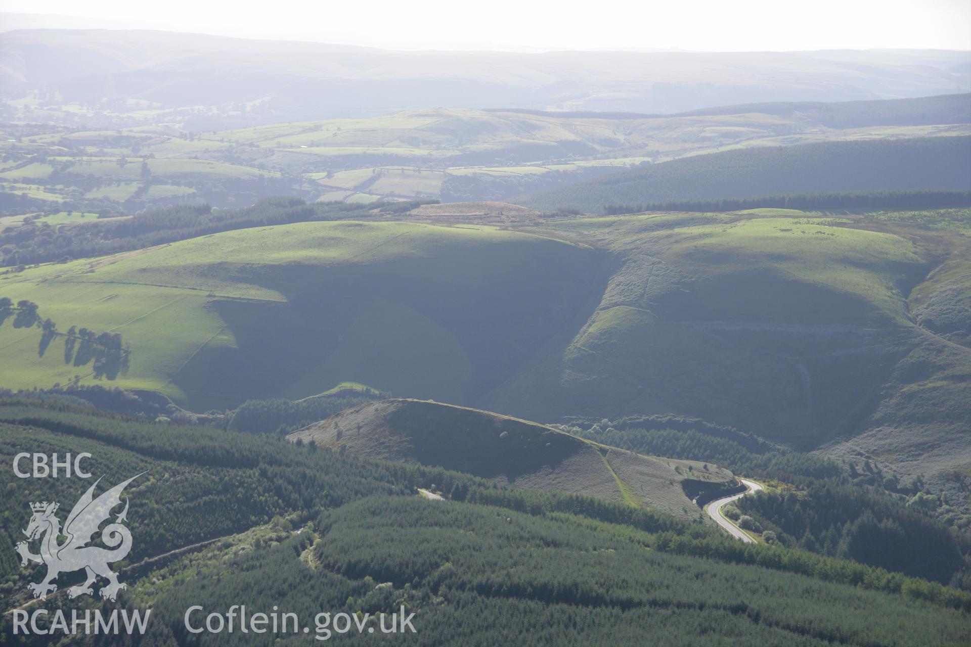 RCAHMW colour oblique aerial photograph of Sugar Loaf Hillfort. Taken on 08 August 2007 by Toby Driver